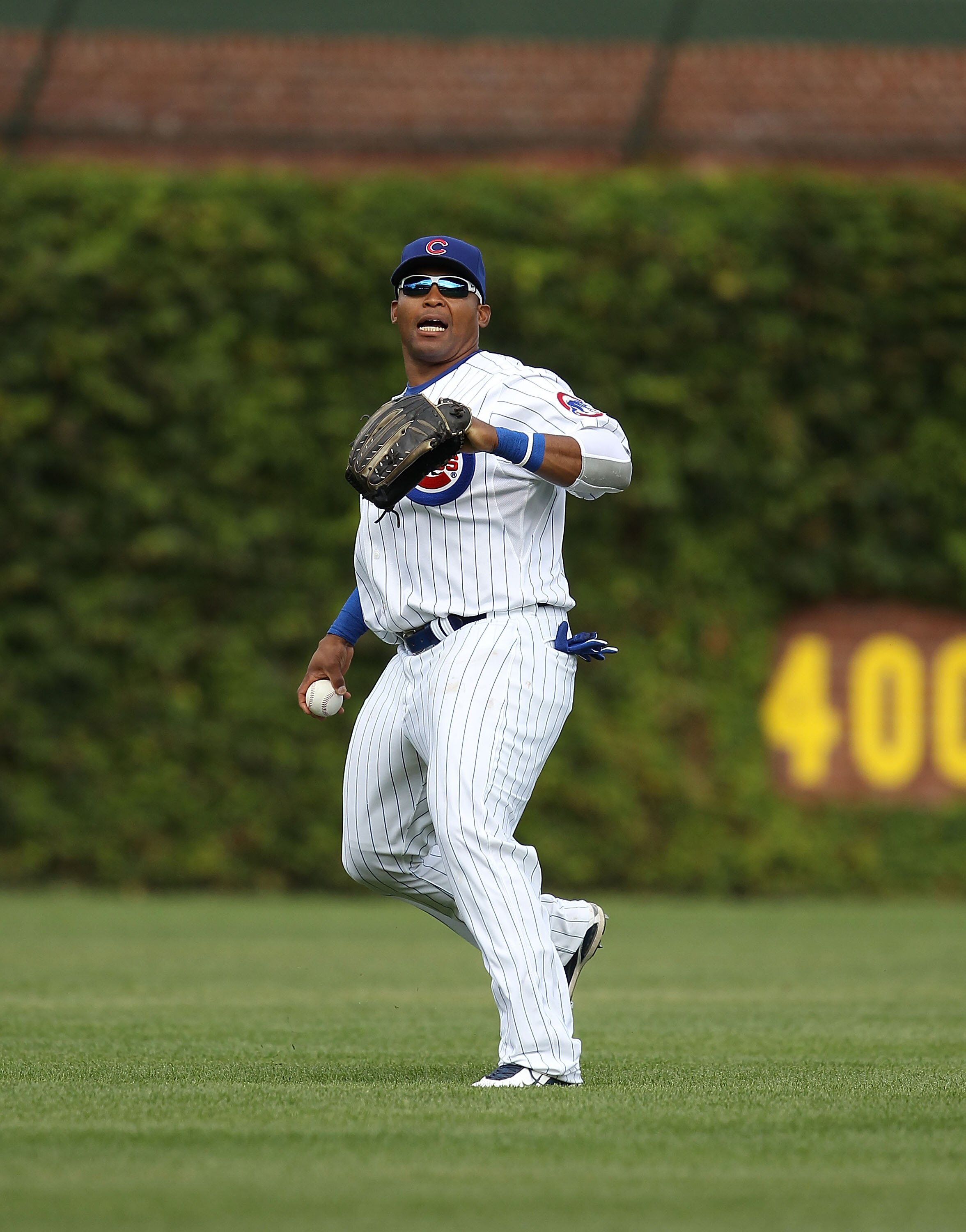 CHICAGO - SEPTEMBER 05: Marlon Byrd #24 of the Chicago Cubs prepares to throw the ball to the infield against the New York Mets at Wrigley Field on September 5, 2010 in Chicago, Illinois. The Mets defeated the Cubs 18-5. (Photo by Jonathan Daniel/Getty Im
