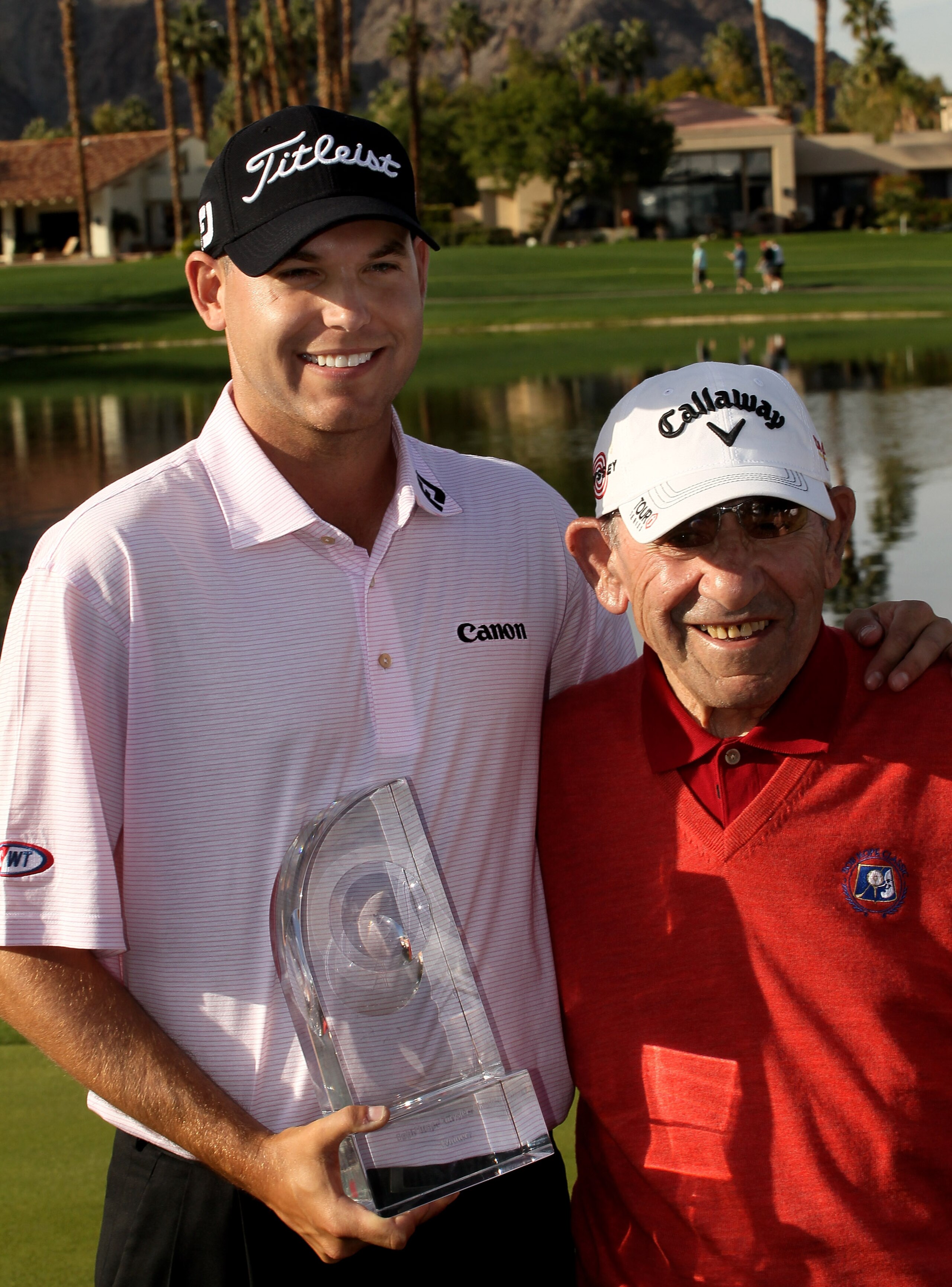 LA QUINTA, CA - JANUARY 25: Bill Haas poses for pictures with tournament ambassador and baseball Hall of Famer Yogi Berra at the Palmer Private course at PGA West after winning the Bob Hope Classic on January 25, 2010 in La Quinta, California. (Photo by S