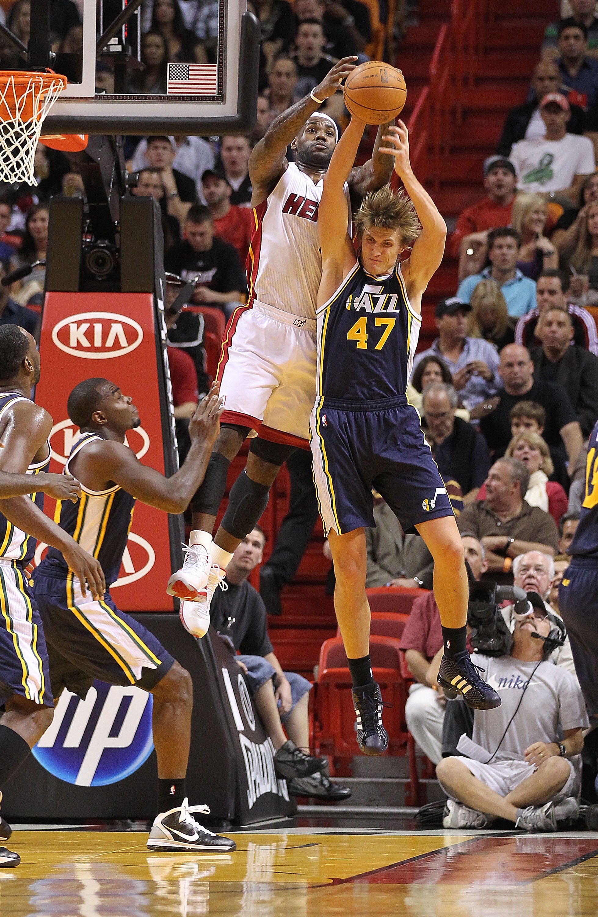 MIAMI - NOVEMBER 09:  Lebron James #6 of the Miami Heat pulls down a rebound over Andrei Kirilenko #47 during a game against the Utah Jazz at American Airlines Arena on November 9, 2010 in Miami, Florida. NOTE TO USER: User expressly acknowledges and agre