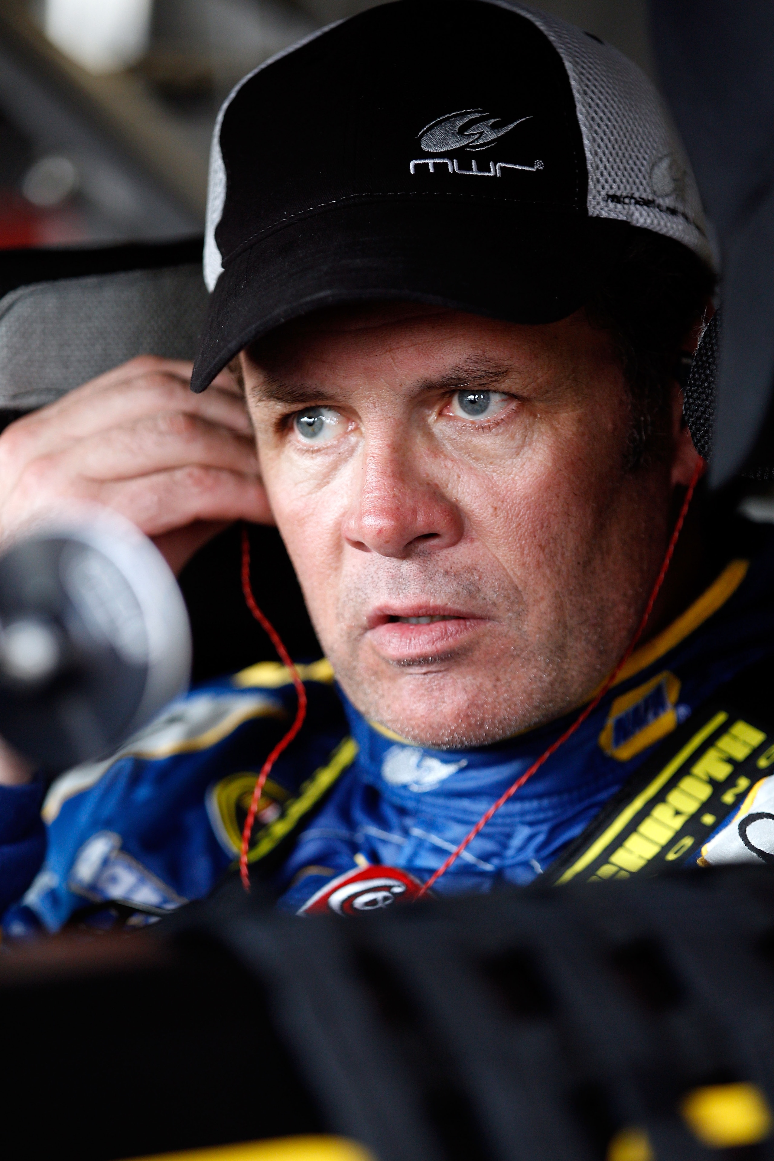 DAYTONA BEACH, FL - FEBRUARY 16:  Michael Waltrip, driver of the #15 NAPA Auto Parts Toyota, sits in his car in the garage area during practice for the NASCAR Sprint Cup Series Daytona 500 at Daytona International Speedway on February 16, 2011 in Daytona