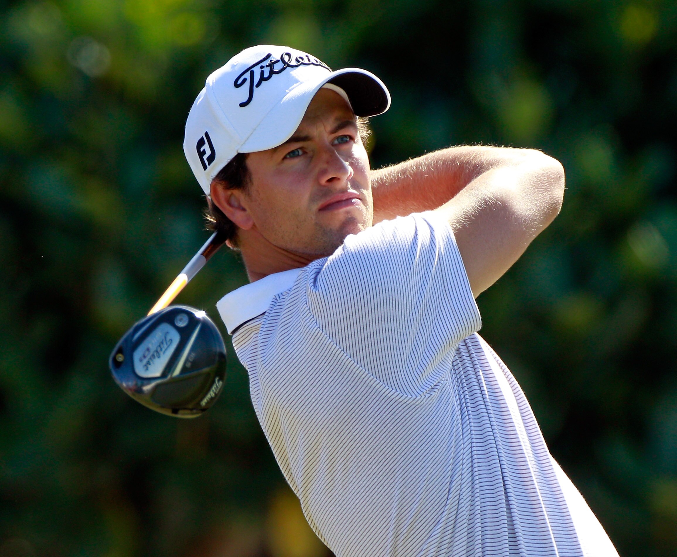 KAPALUA, HI - JANUARY 09:  Adam Scott of Australia hits a shot during the final round of the Hyundai Tournament of Champions at the Plantation course on January 9, 2011 in Kapalua, Hawaii.  (Photo by Sam Greenwood/Getty Images)
