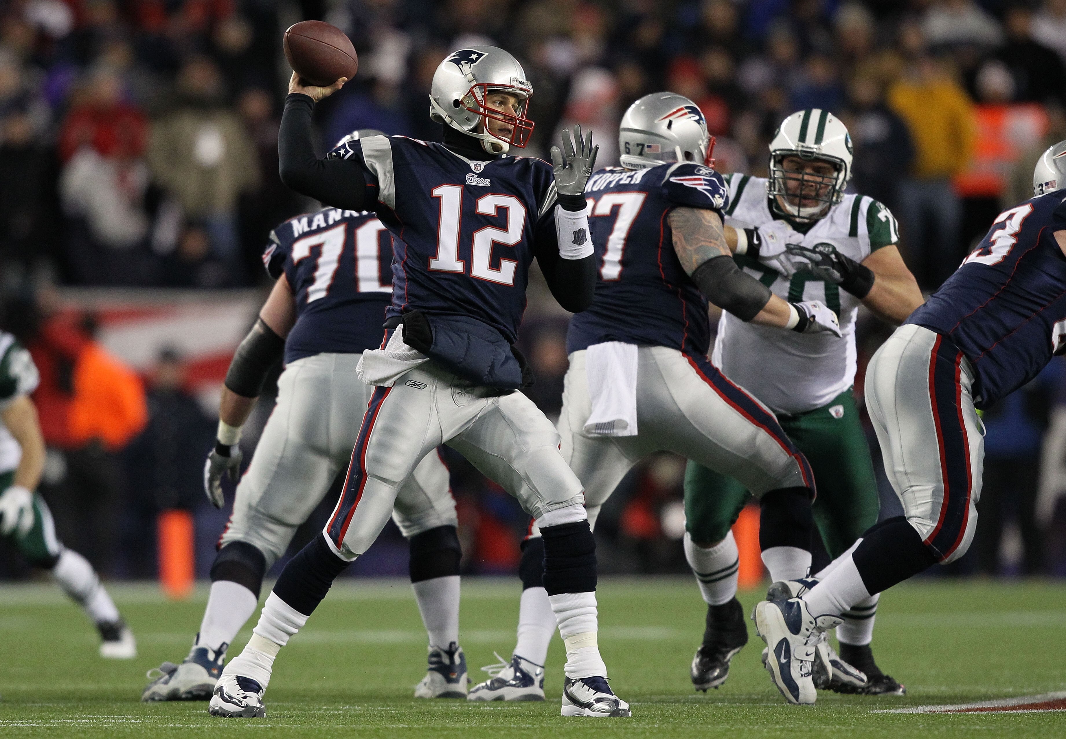 FOXBORO, MA - JANUARY 16:  Quarterback Tom Brady #12 of the New England Patriots throws a pass during their 2011 AFC divisional playoff game against the New York Jets at Gillette Stadium on January 16, 2011 in Foxboro, Massachusetts.  (Photo by Al Bello/G