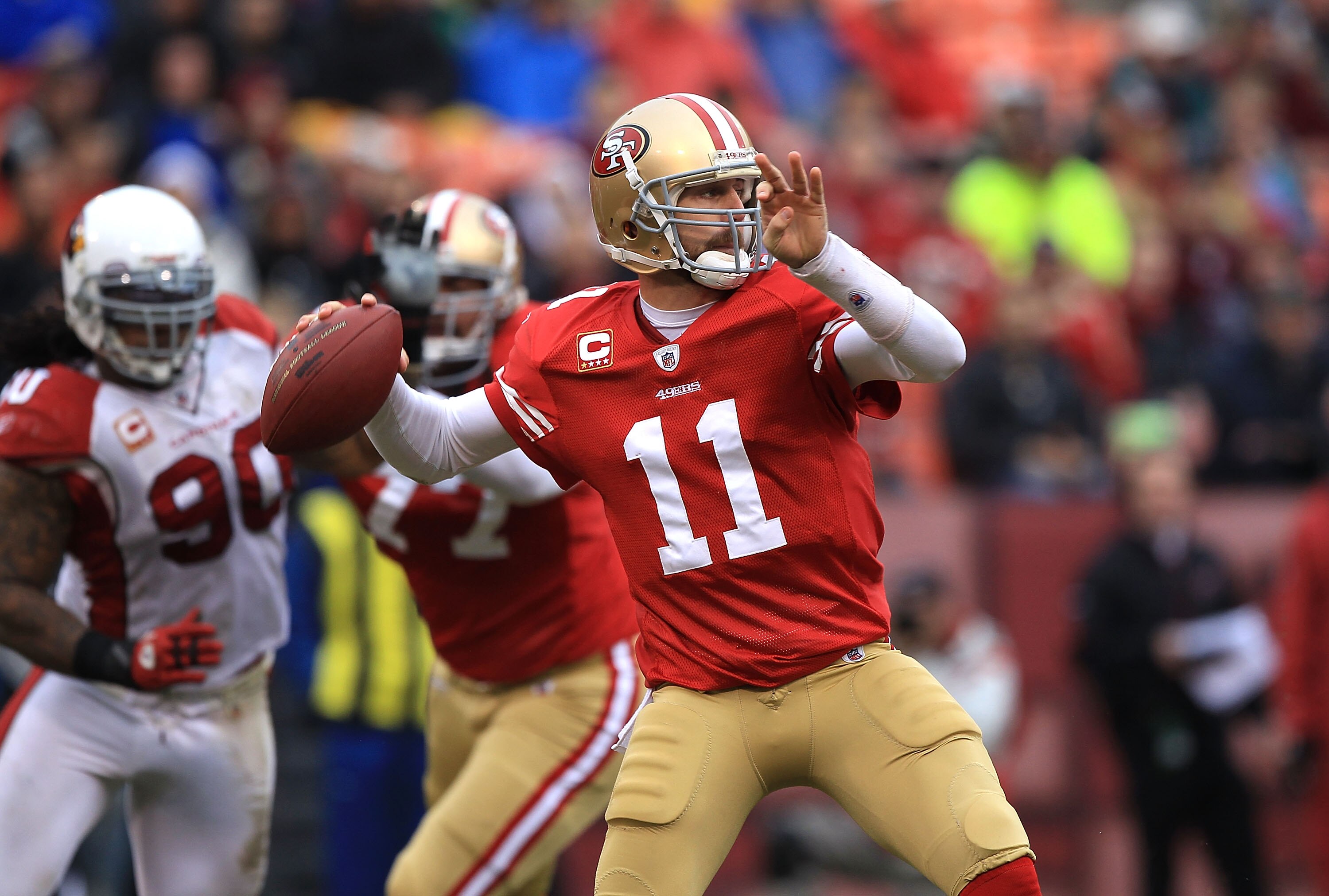 SAN FRANCISCO, CA - JANUARY 2:  Alex Smith #11 of the San Francisco 49ers passes against the Arizona Cardinals during an NFL game at Candlestick Park on January 2, 2011 in San Francisco, California.(Photo by Jed Jacobsohn/Getty Images)