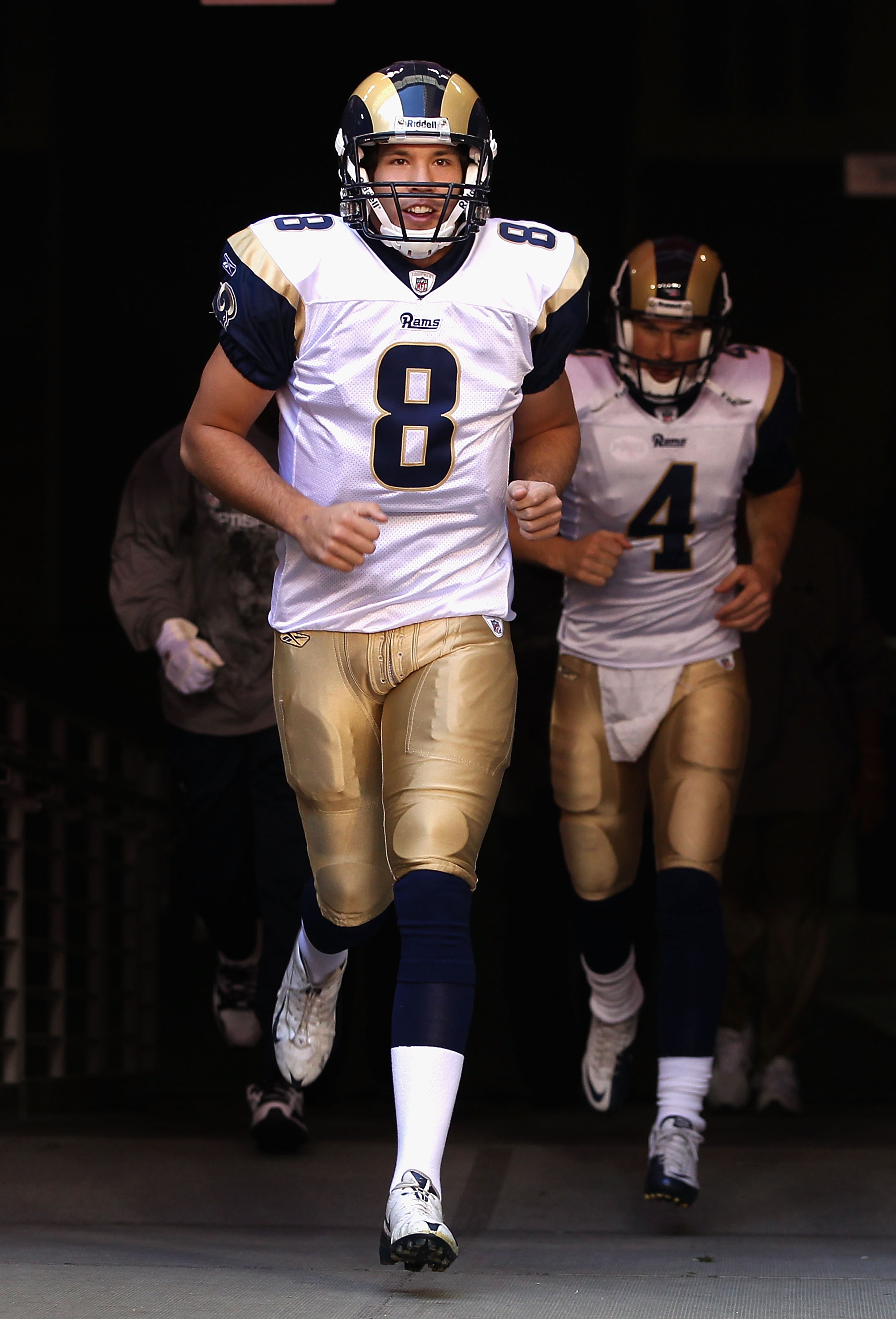 GLENDALE, AZ - DECEMBER 05:  Quarterback Sam Bradford #8 of the St. Louis Rams runs out onto the field before the NFL game against the Arizona Cardinals at the University of Phoenix Stadium on December 5, 2010 in Glendale, Arizona.  (Photo by Christian Pe