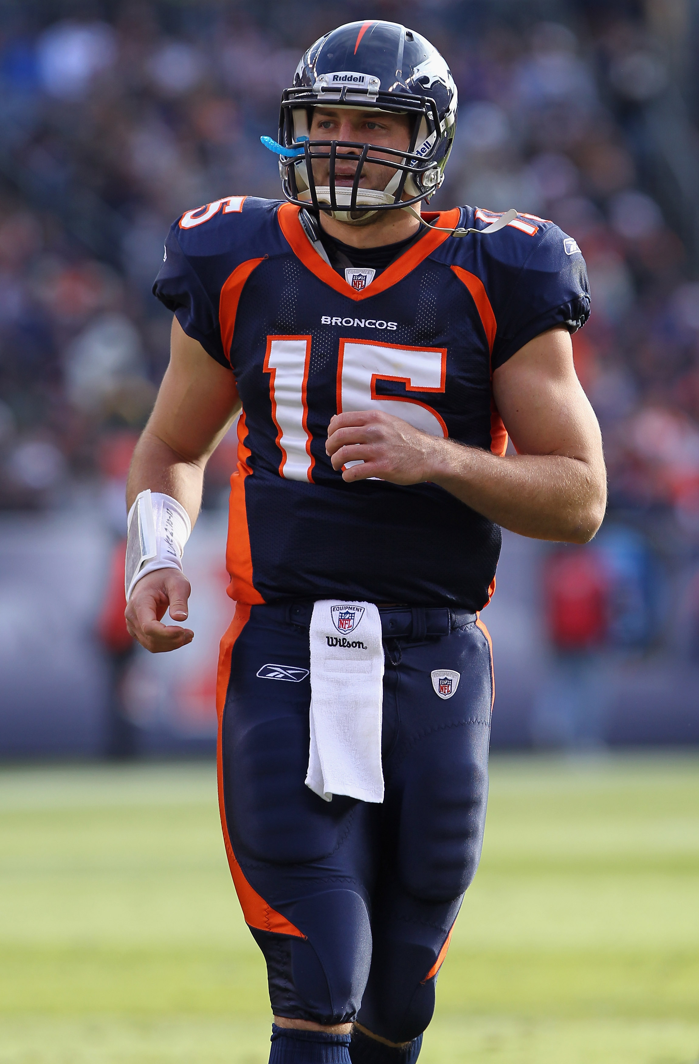 DENVER - DECEMBER 26:  Quarterback Tim Tebow #15 of the Denver Broncos looks on as he faces the Houston Texas at INVESCO Field at Mile High on December 26, 2010 in Denver, Colorado. The Broncos defeated the Texans 24-23.  (Photo by Doug Pensinger/Getty Im