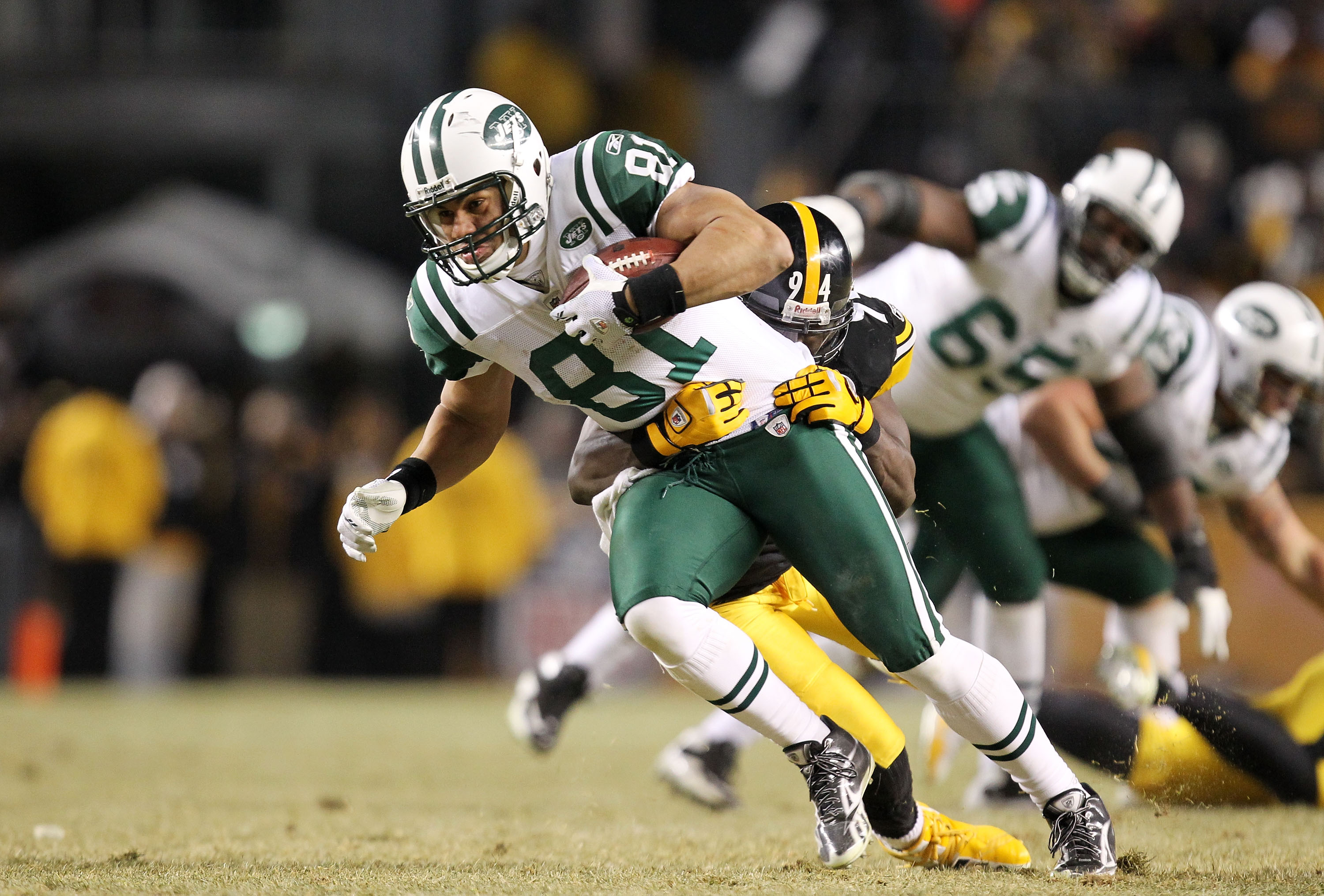 PITTSBURGH, PA - JANUARY 23:  Dustin Keller #81 of the New York Jets is tackled by Lawrence Timmons #94 of the Pittsburgh Steelers during the 2011 AFC Championship game at Heinz Field on January 23, 2011 in Pittsburgh, Pennsylvania.  (Photo by Ronald Mart