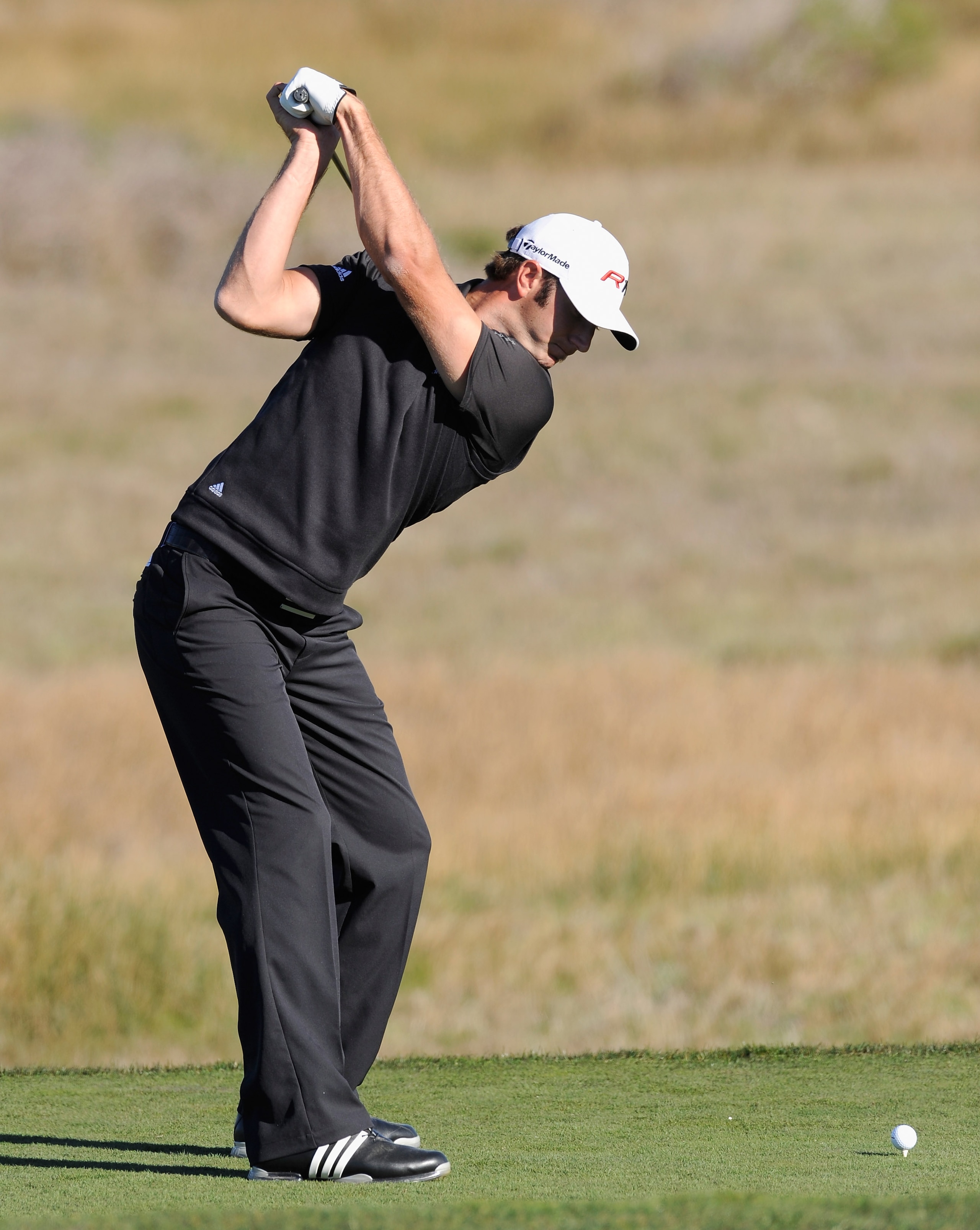 PEBBLE BEACH, CA - FEBRUARY 10:  Dustin Johnson plays a shot during the first round of the AT&T Pebble Beach National Pro-Am at Monterey Peninsula Country Club on February 10, 2011  in Pebble Beach, California.  (Photo by Stuart Franklin/Getty Images)