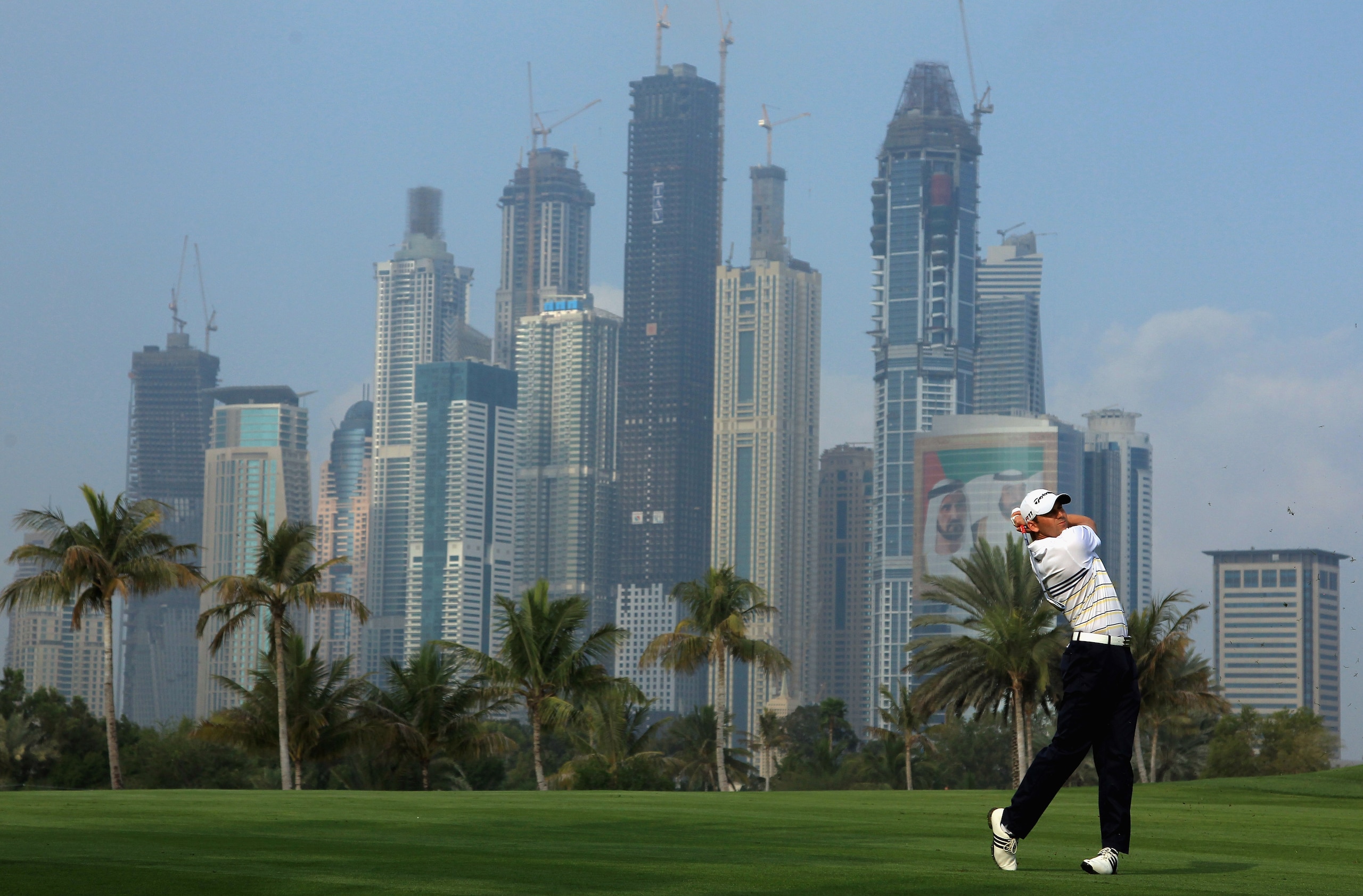 DUBAI, UNITED ARAB EMIRATES - FEBRUARY 10:  Sergio Garcia of Spain plays his second shot on the 13th hole during the first round of the Omega Dubai Desert Classic on the Majlis course at the Emirates Golf Club on February 10, 2011 in Dubai, United Arab Em