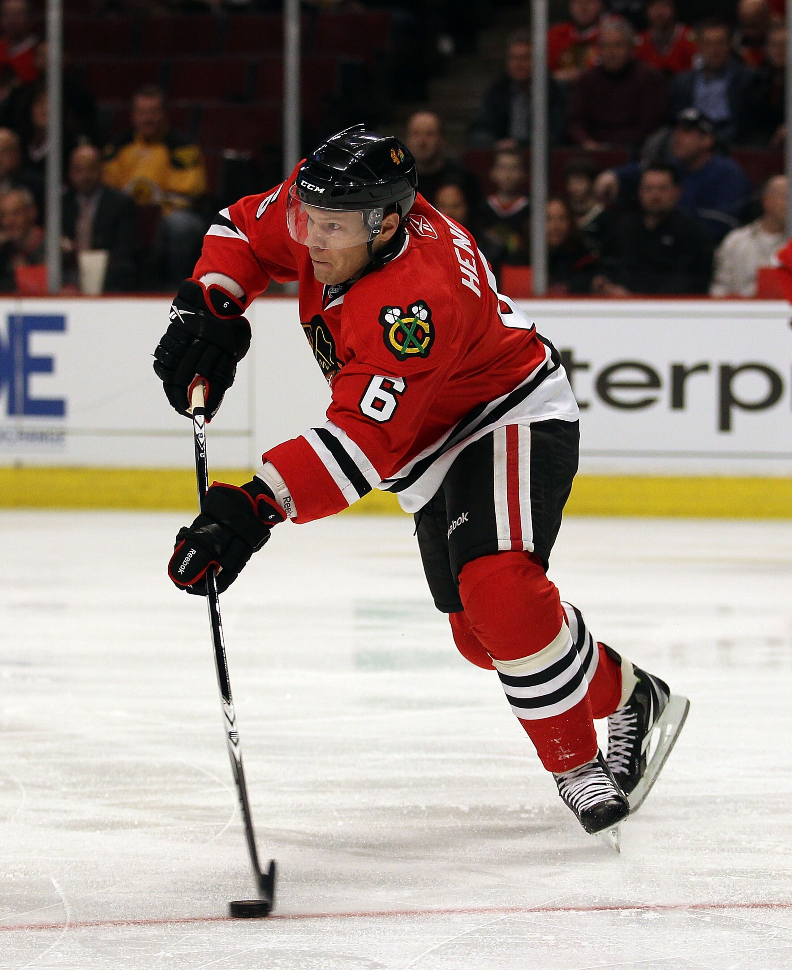 CHICAGO, IL - FEBRUARY 16: Jordan Hendry #6 of the Chicago Blackhawks looks to pass against the Minnesota Wild at the United Center on February 16, 2011 in Chicago, Illinois. The Blackhawks defeated the Wild 3-1. (Photo by Jonathan Daniel/Getty Images)
