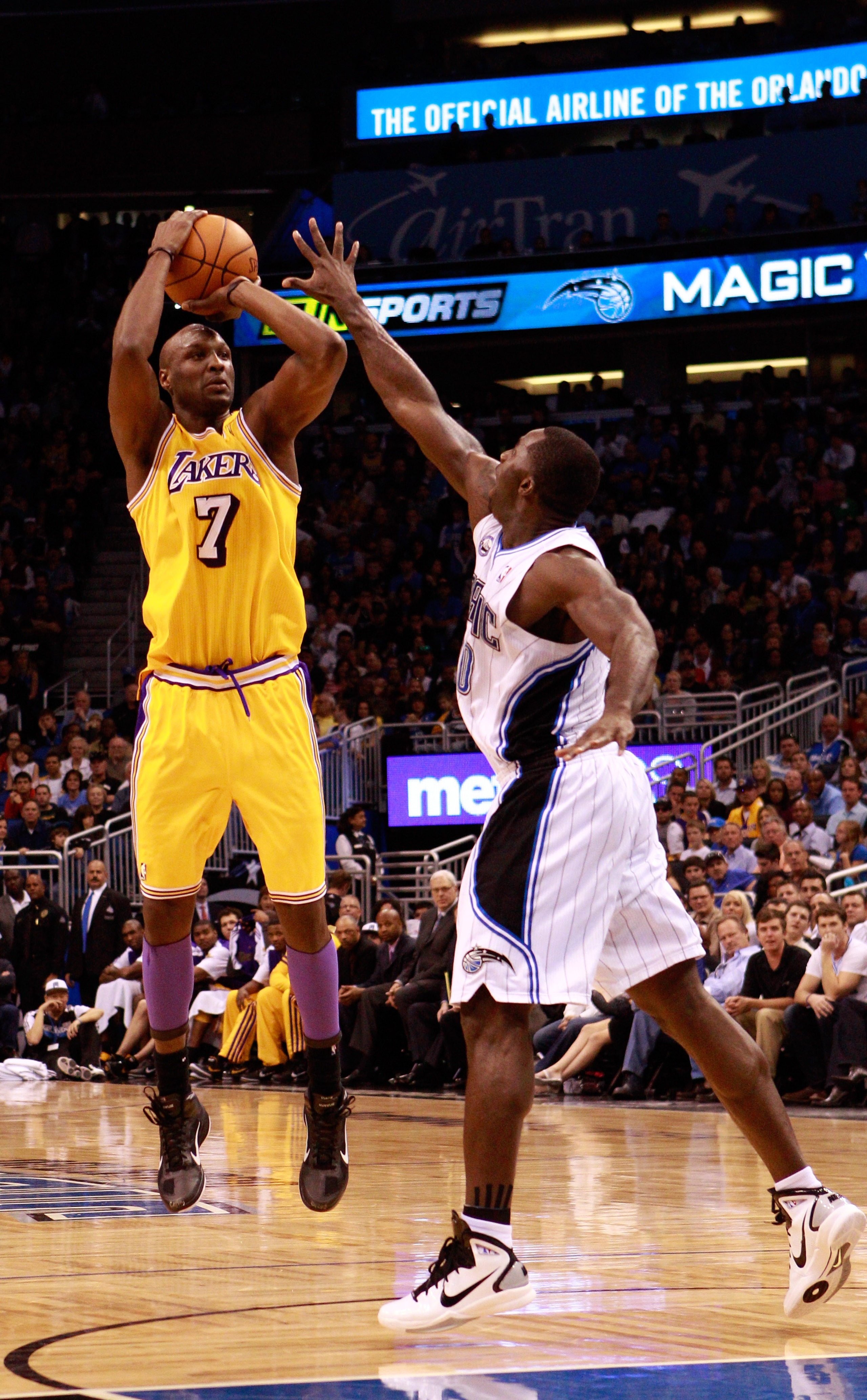 ORLANDO, FL - FEBRUARY 13: Lamar Odom #7 of the Los Angeles Lakers attempts a shot over Brandon Bass #30 of the Orlando Magic during the game at Amway Arena on February 13, 2011 in Orlando, Florida. NOTE TO USER: User expressly acknowledges and agrees ORLANDO, FL - FEBRUARY 13: Lamar Odom #7 of the Los Angeles Lakers attempts a shot over Brandon Bass #30 of the Orlando Magic during the game at Amway Arena on February 13, 2011 in Orlando, Florida. NOTE TO USER: User expressly acknowledges and agrees