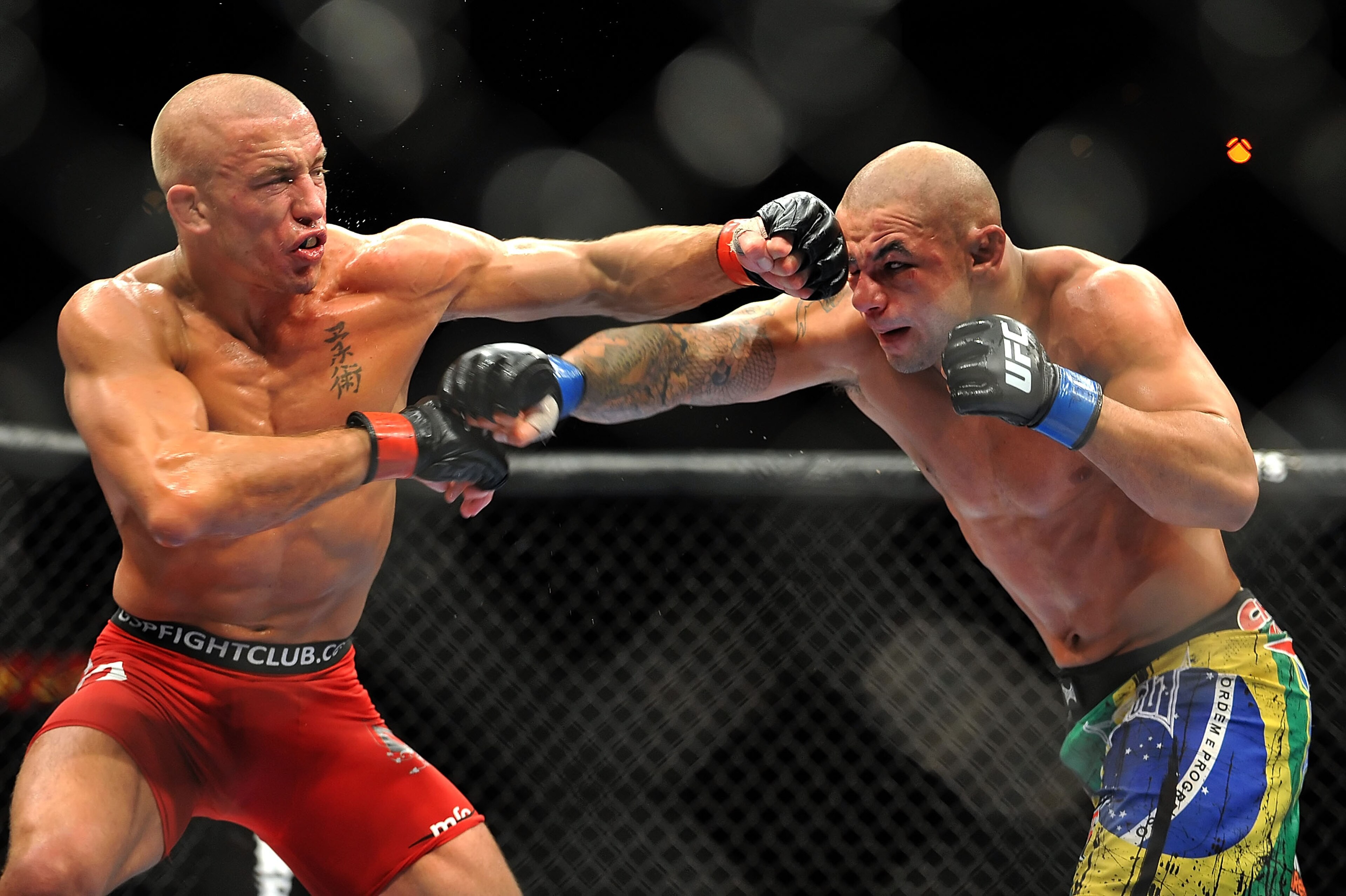 LAS VEGAS - JULY 11:  (L-R) Georges St. Pierre battles Thiago Alves during their welterweight title bout during UFC 100 on July 11, 2009 in Las Vegas, Nevada.  (Photo by Jon Kopaloff/Getty Images)