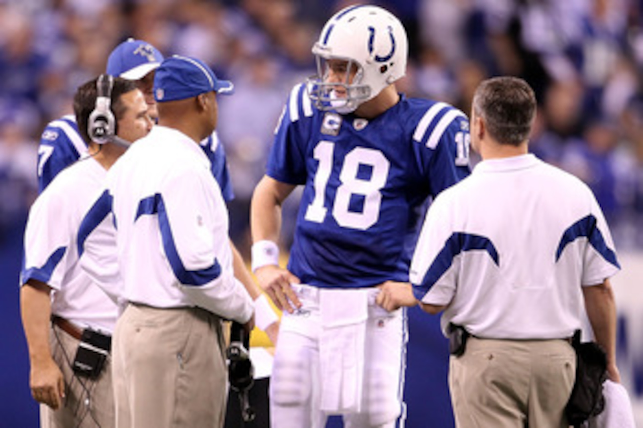 INDIANAPOLIS, IN - JANUARY 08: Quarterback Peyton Manning #18 of the Indianapolis Colts talks with head coach Jim Caldwell against the New York Jets during their 2011 AFC wild card playoff game at Lucas Oil Stadium on January 8, 2011 in Indianapolis, Ind INDIANAPOLIS, IN - JANUARY 08: Quarterback Peyton Manning #18 of the Indianapolis Colts talks with head coach Jim Caldwell against the New York Jets during their 2011 AFC wild card playoff game at Lucas Oil Stadium on January 8, 2011 in Indianapolis, Ind