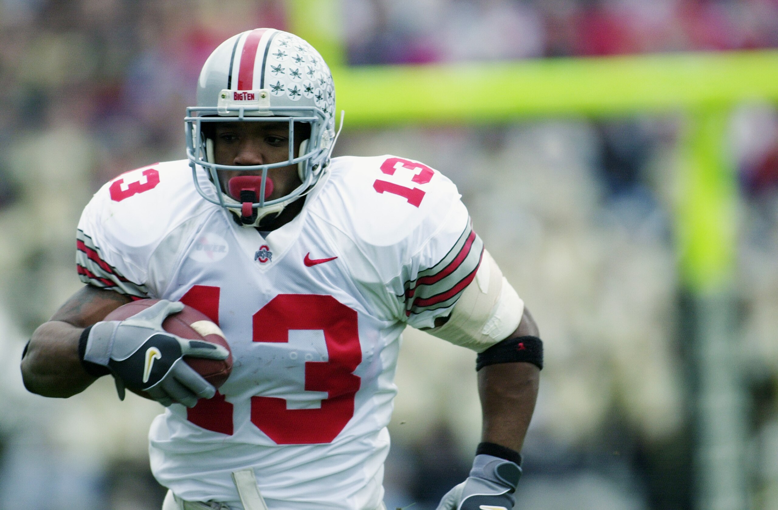 WEST LAFAYETTE, IN - NOVEMBER 9: Tailback Maurice Clarett #13 of the Ohio State University Buckeyes carries the ball against the Purdue University Boilermakers during the game at Ross-Ade Stadium at Purdue University on November 9, 2002 in West Lafayette WEST LAFAYETTE, IN - NOVEMBER 9: Tailback Maurice Clarett #13 of the Ohio State University Buckeyes carries the ball against the Purdue University Boilermakers during the game at Ross-Ade Stadium at Purdue University on November 9, 2002 in West Lafayette