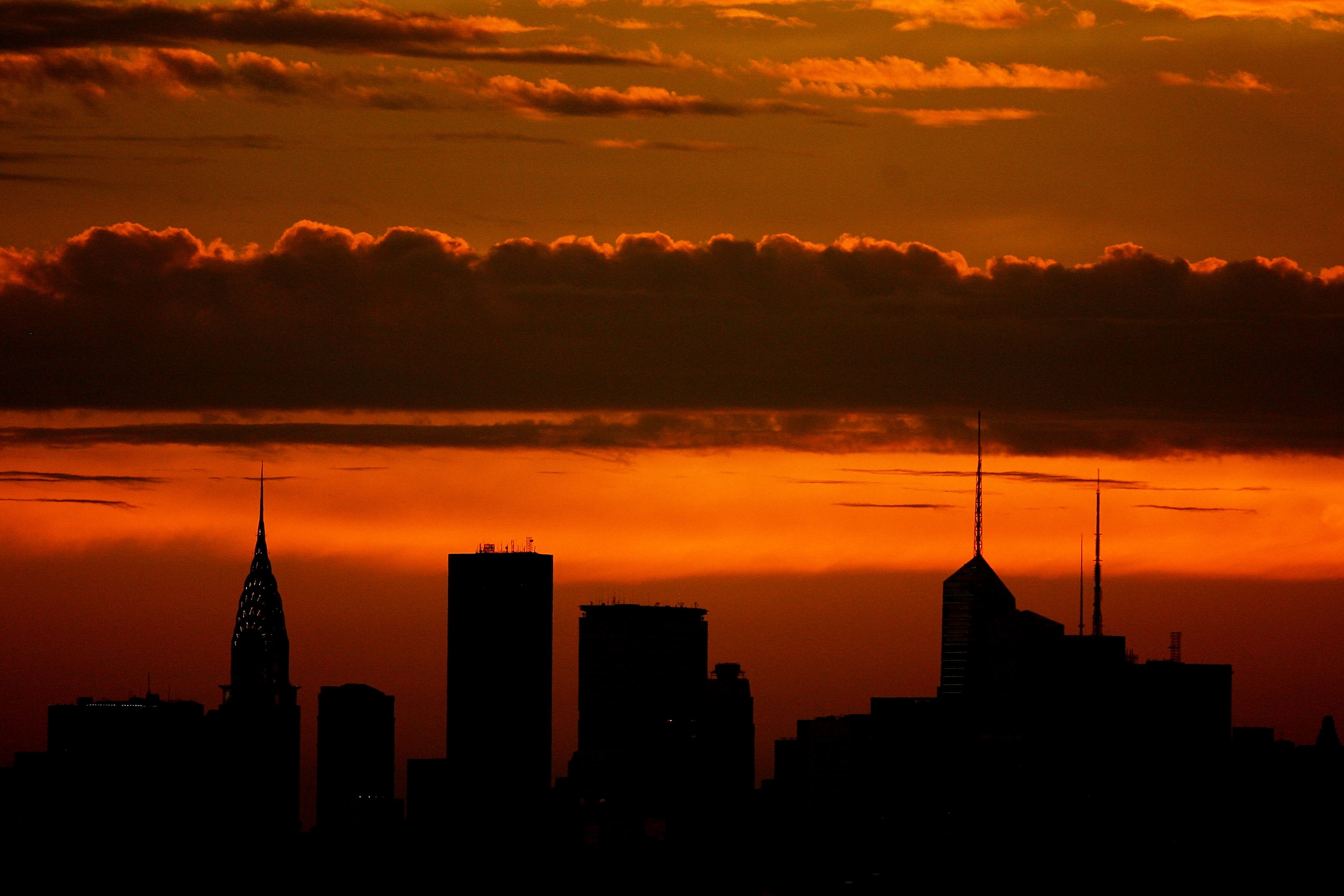 NEW YORK - SEPTEMBER 03:  The sun sets over the New York skyline during day five of the 2010 U.S. Open at the USTA Billie Jean King National Tennis Center on September 3, 2010 in the Flushing neighborhood of the Queens borough of New York City.  (Photo by