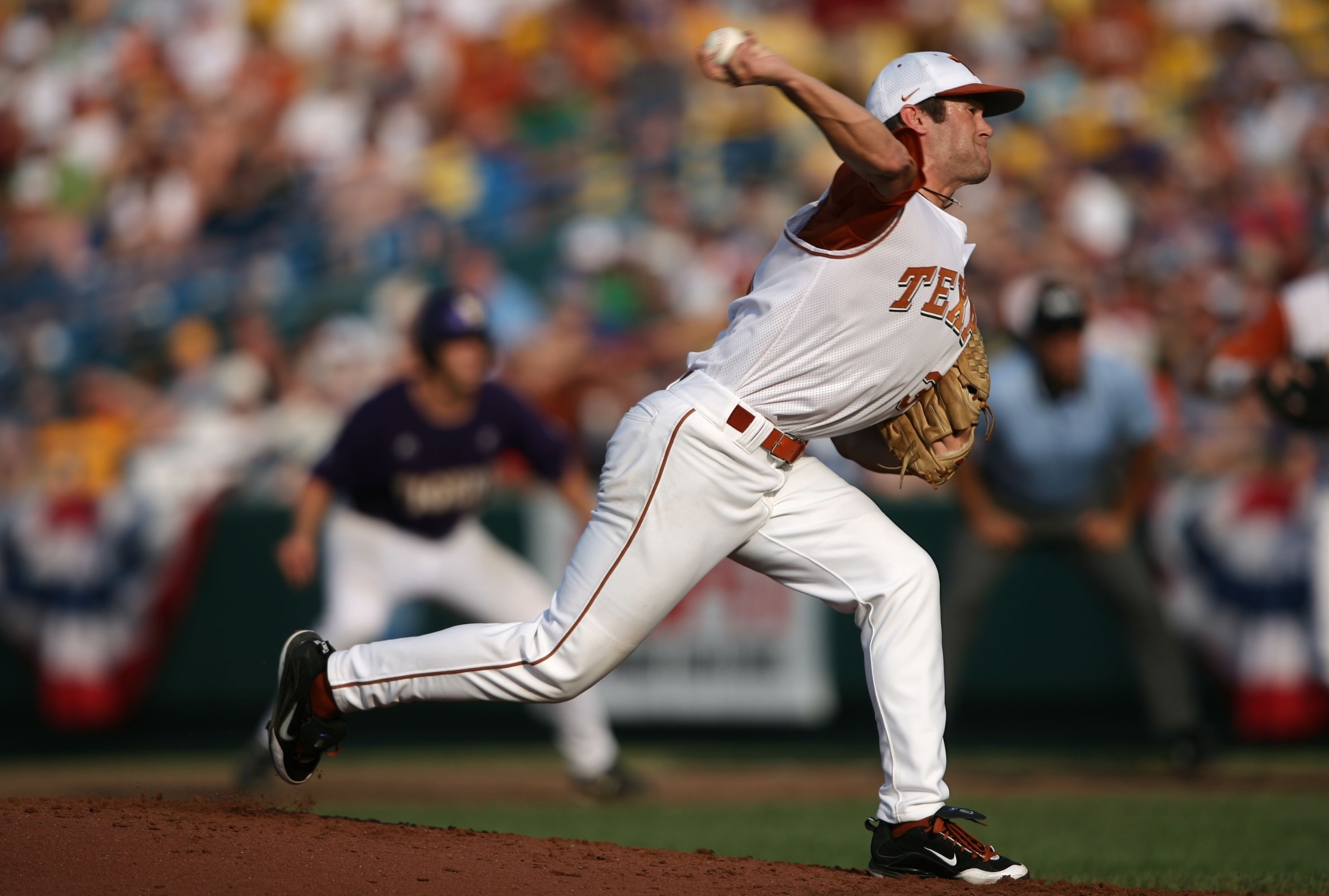 OMAHA, NE - JUNE 22:  Chance Ruffin #31 of the Texas Longhorns pitches with a runner on first base against the Louisiana State University Tigers during Game One of the 2009 NCAA College World Series at Rosenblatt Stadium on June 22, 2009 in Omaha, Nebrask