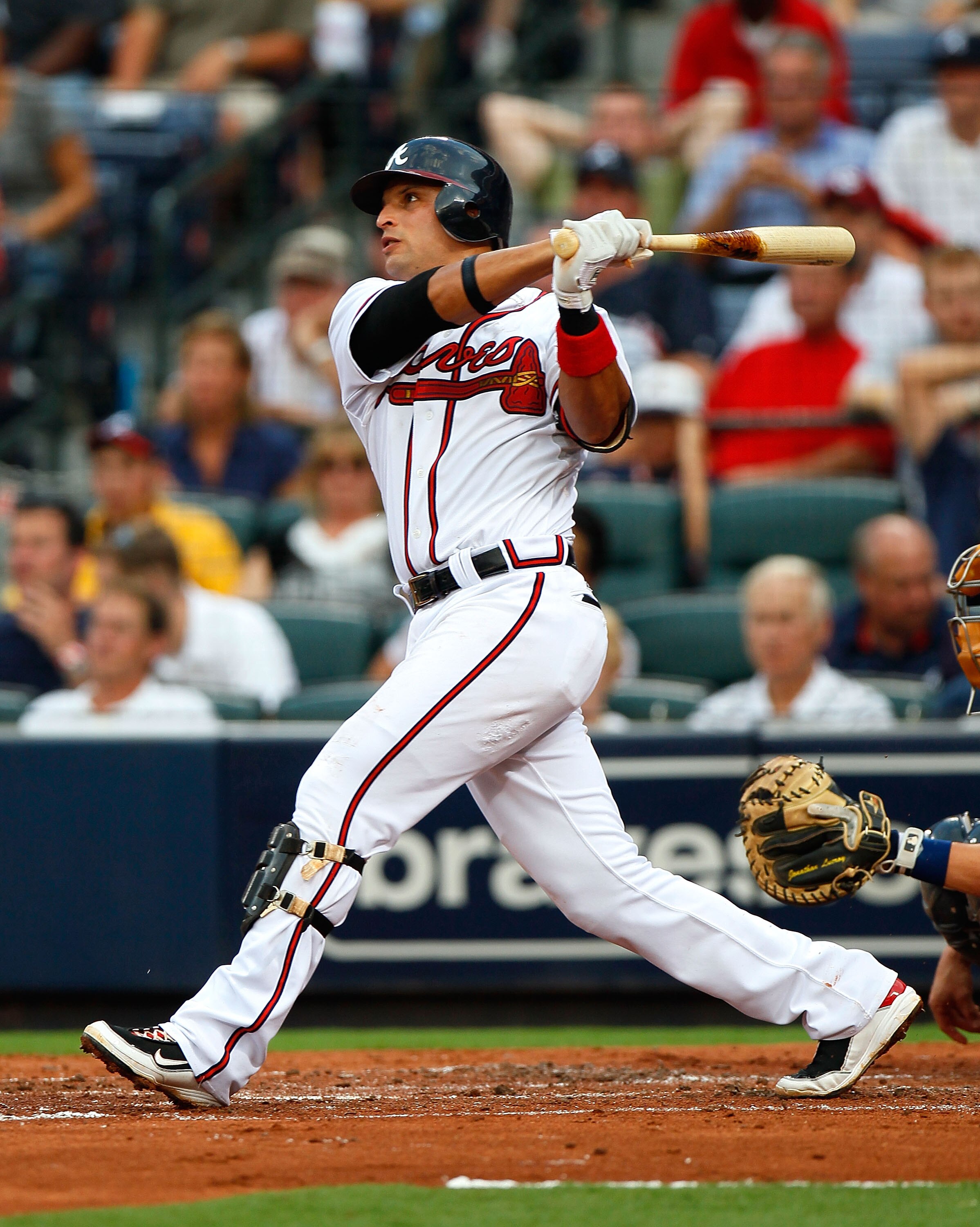 ATLANTA - JULY 15:  Martin Prado #14 of the Atlanta Braves hits a solo homer in the third inning against the Milwaukee Brewers at Turner Field on July 15, 2010 in Atlanta, Georgia.  (Photo by Kevin C. Cox/Getty Images)