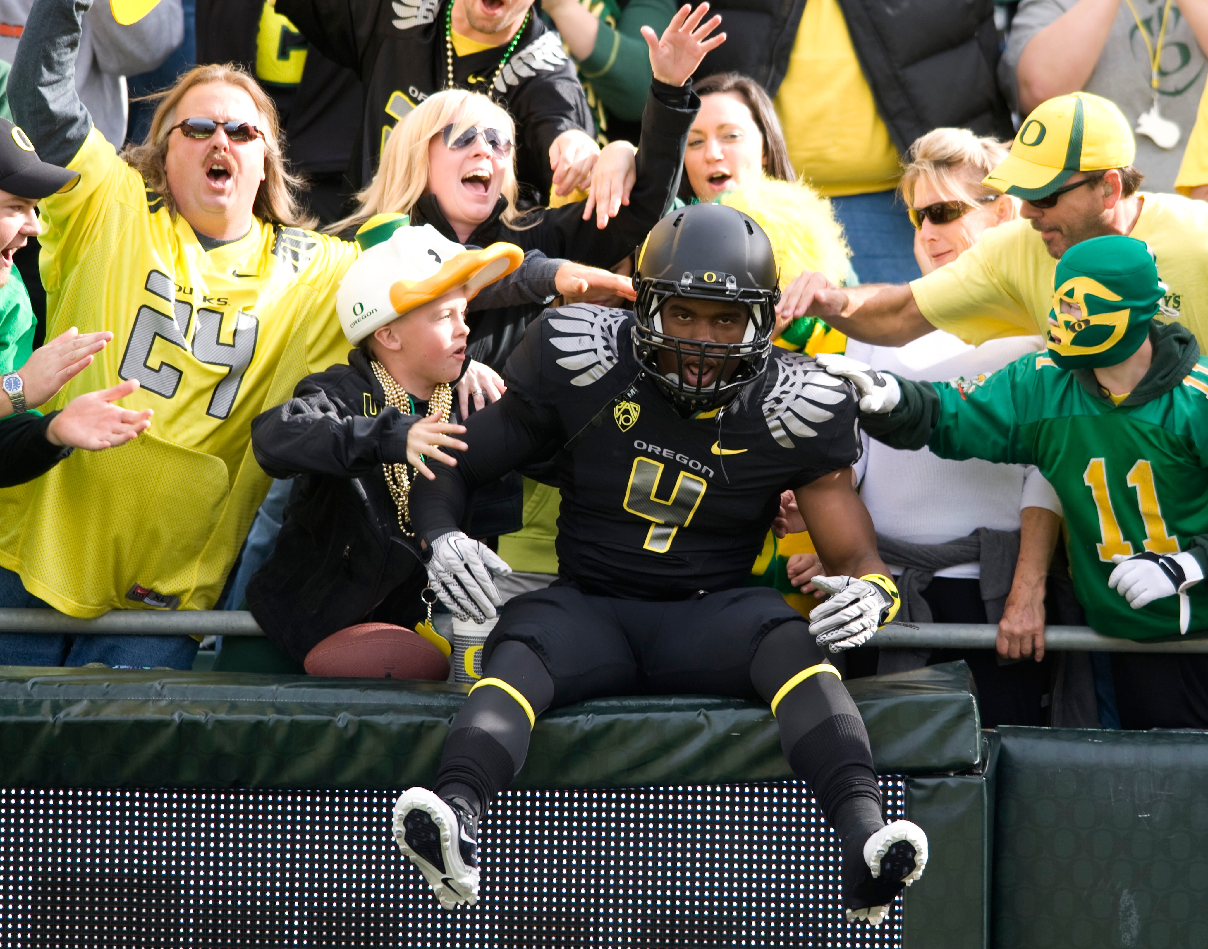 EUGENE, OR - NOVEMBER 6: Wide receiver Josh Huff #4 of the Oregon Ducks jumps into the crowd during the team introductions before the game against the Washington Huskies at Autzen Stadium on November 6, 2010 in Eugene, Oregon. The Ducks won the game 53-16
