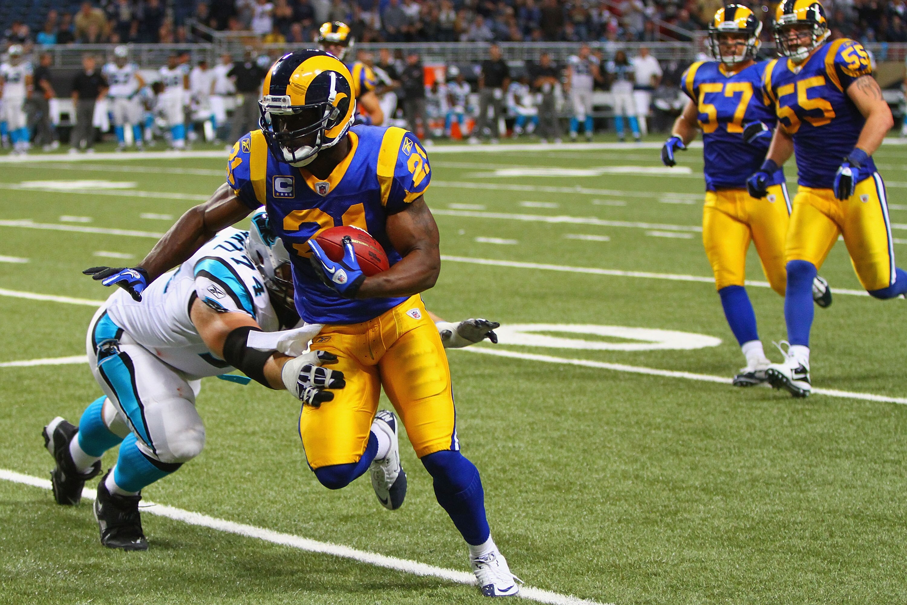 ST. LOUIS - OCTOBER 31: Oshiomogho Atogwe #21 of the St. Louis Rams returns an interception against the Carolina Panthers at the Edward Jones Dome on October 31, 2010 in St. Louis, Missouri.  The Rams beat the Panthers 20-10.  (Photo by Dilip Vishwanat/Ge