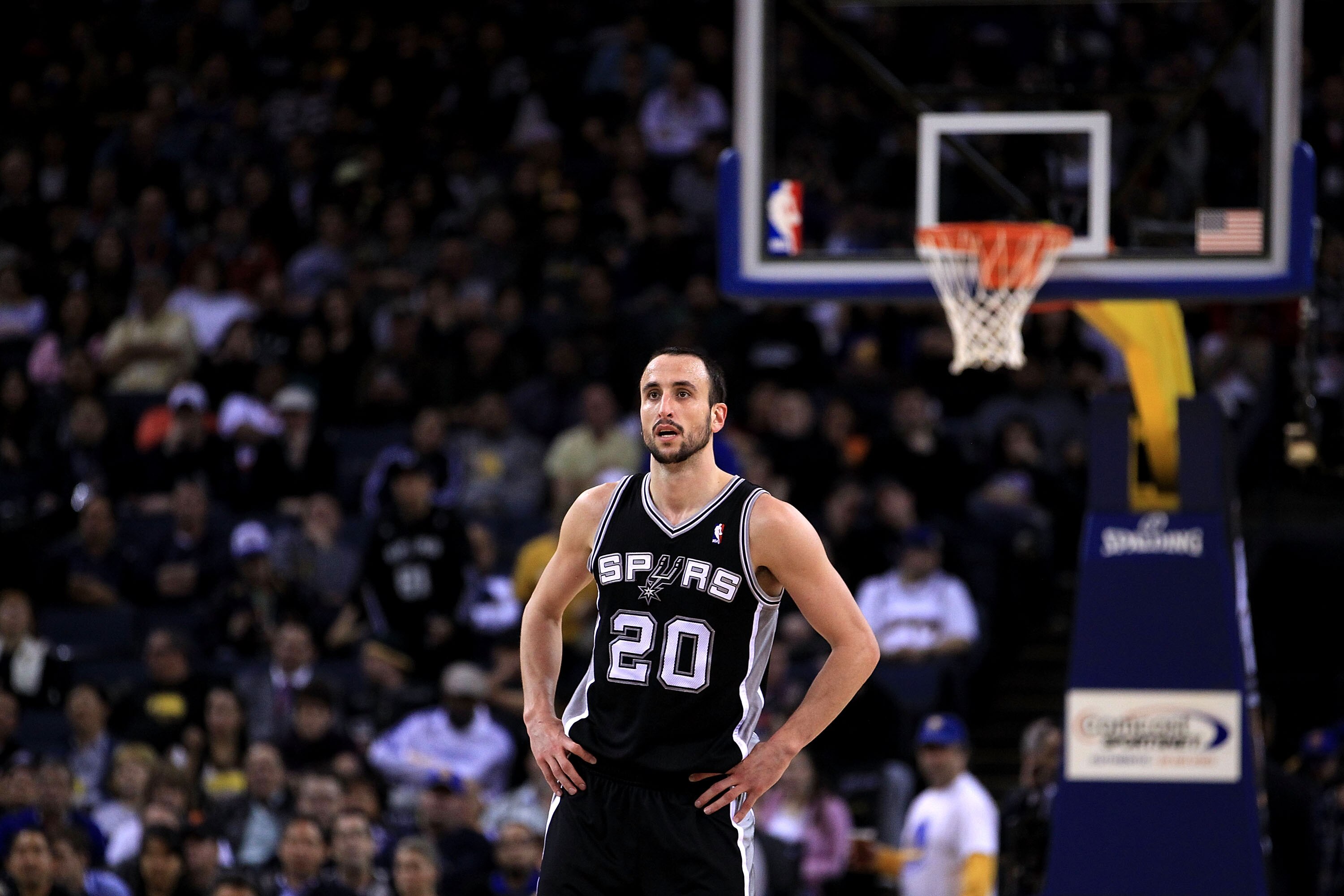 OAKLAND, CA - JANUARY 24:  Manu Ginobili #20 of the San Antonio Spurs in action against the Golden State Warriors at Oracle Arena on January 24, 2011 in Oakland, California.  NOTE TO USER: User expressly acknowledges and agrees that, by downloading and or