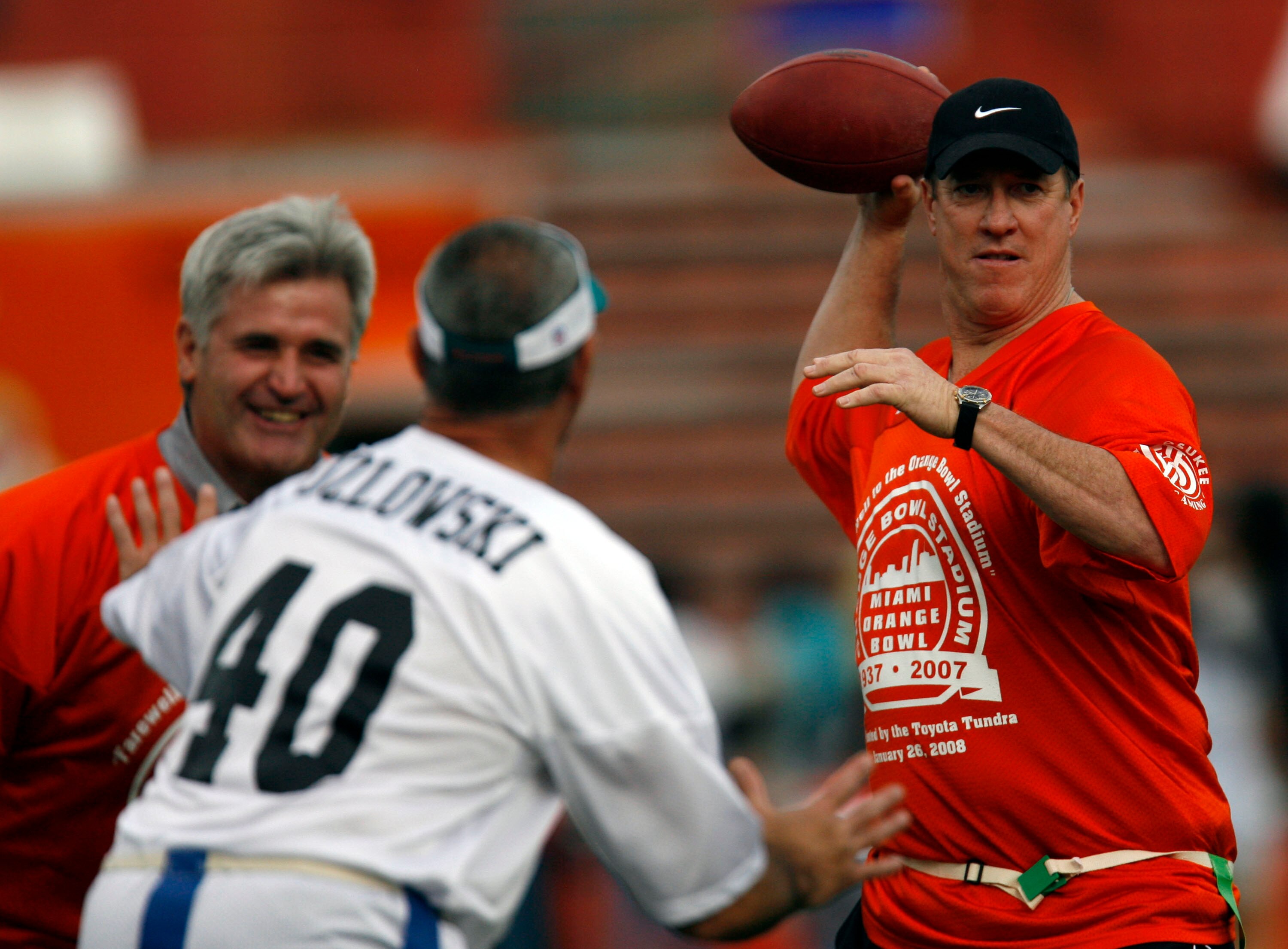 MIAMI, FL - JANUARY 26: Former University of Miami Hurricanes Quarterback Jim Kelly throws a pass during the final game at the Orange Bowl against the Miami Dolphins January 26, 2008 in Miami, Florida. This is the last game to be played in the Orange Bowl