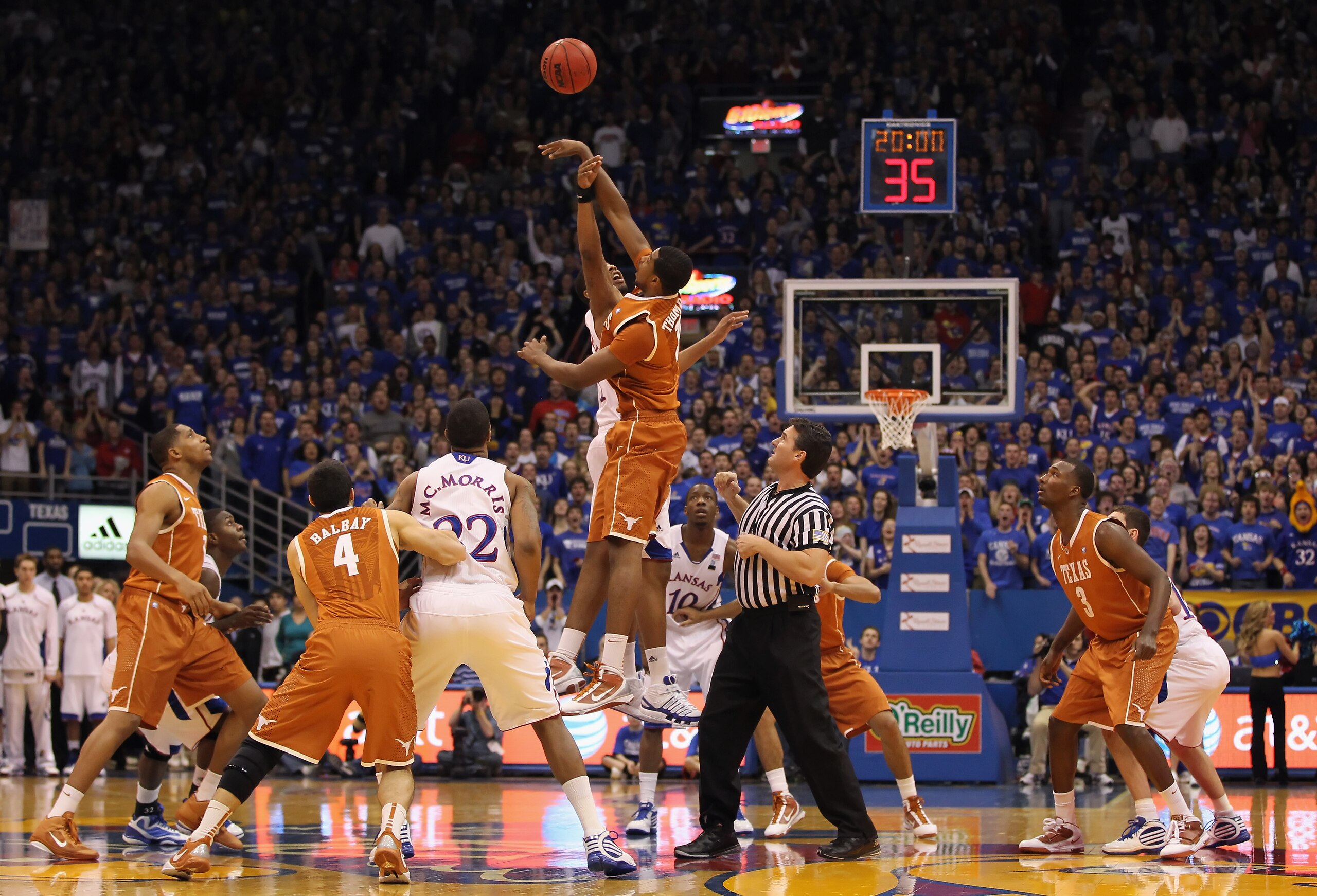 LAWRENCE, KS - JANUARY 22: Tristan Thompson #13 of the Texas Longhorns wins the opening tip-off over Markieff Morris #21 of the Kansas Jayhawks during the game on January 22, 2011 at Allen Fieldhouse in Lawrence, Kansas. (Photo by Jamie Squire/Getty Ima LAWRENCE, KS - JANUARY 22: Tristan Thompson #13 of the Texas Longhorns wins the opening tip-off over Markieff Morris #21 of the Kansas Jayhawks during the game on January 22, 2011 at Allen Fieldhouse in Lawrence, Kansas. (Photo by Jamie Squire/Getty Ima