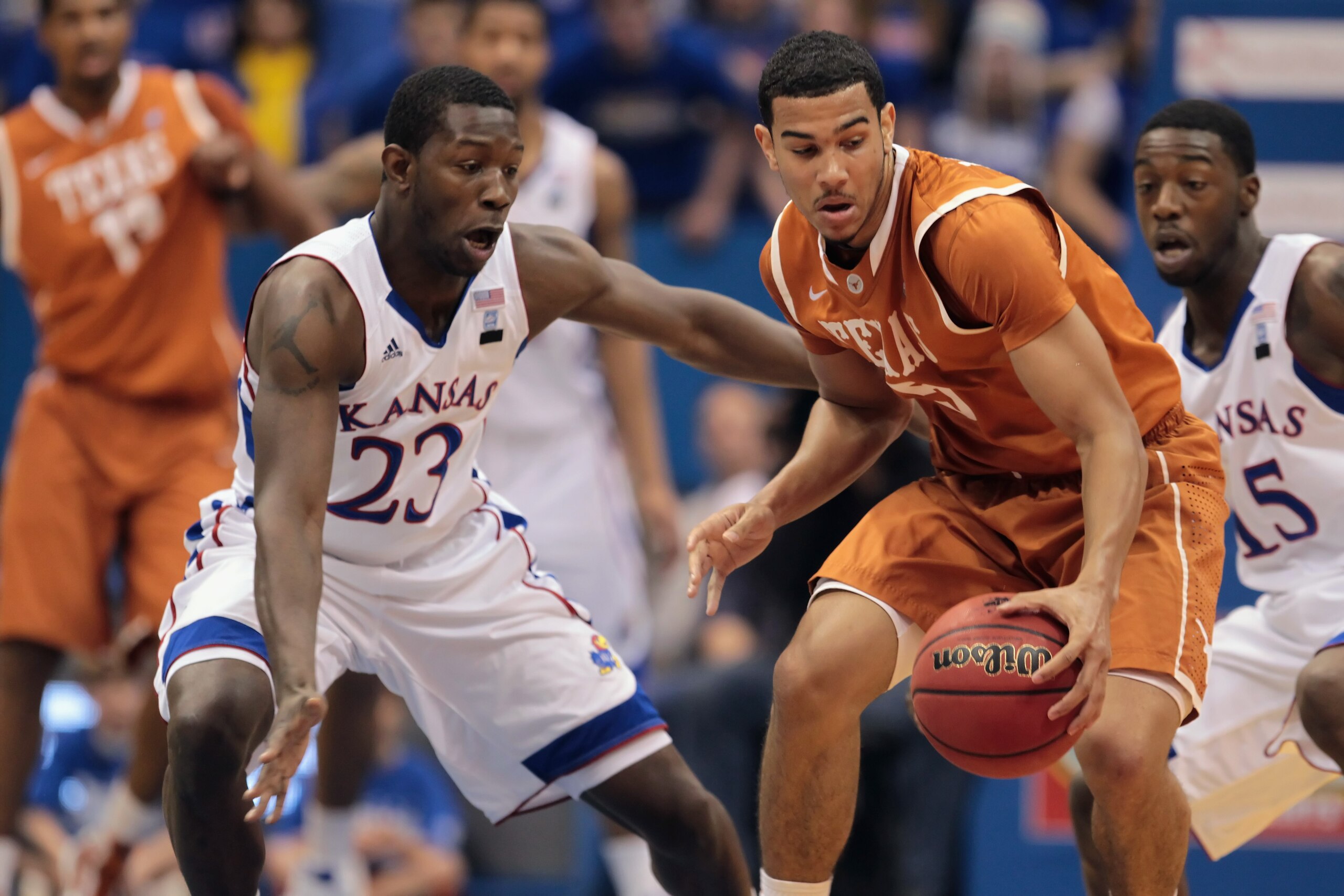 LAWRENCE, KS - JANUARY 22: Cory Joseph #5 of the Texas Longhorns controls the ball as Mario Little #23 of the Kansas Jayhawks defends during the game on January 22, 2011 at Allen Fieldhouse in Lawrence, Kansas. (Photo by Jamie Squire/Getty Images) LAWRENCE, KS - JANUARY 22: Cory Joseph #5 of the Texas Longhorns controls the ball as Mario Little #23 of the Kansas Jayhawks defends during the game on January 22, 2011 at Allen Fieldhouse in Lawrence, Kansas. (Photo by Jamie Squire/Getty Images)