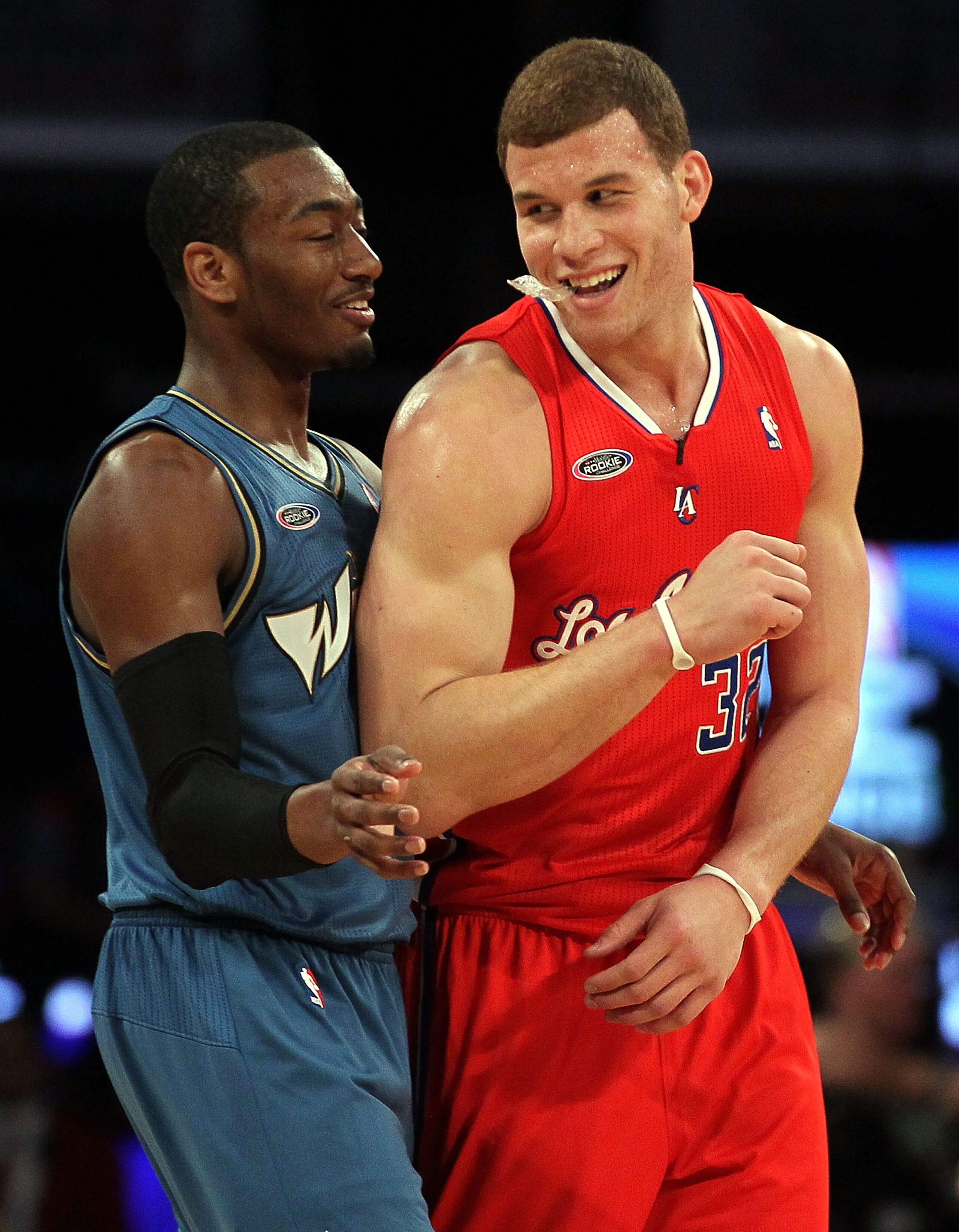 LOS ANGELES, CA - FEBRUARY 18:  John Wall #2 of the Washington Wizards and the Rookie Team and Blake Griffin #32 of the Los Angeles Clippers and the Rookie Team laugh on the court in the second half during the T-Mobile Rookie Challenge and Youth Jam at St