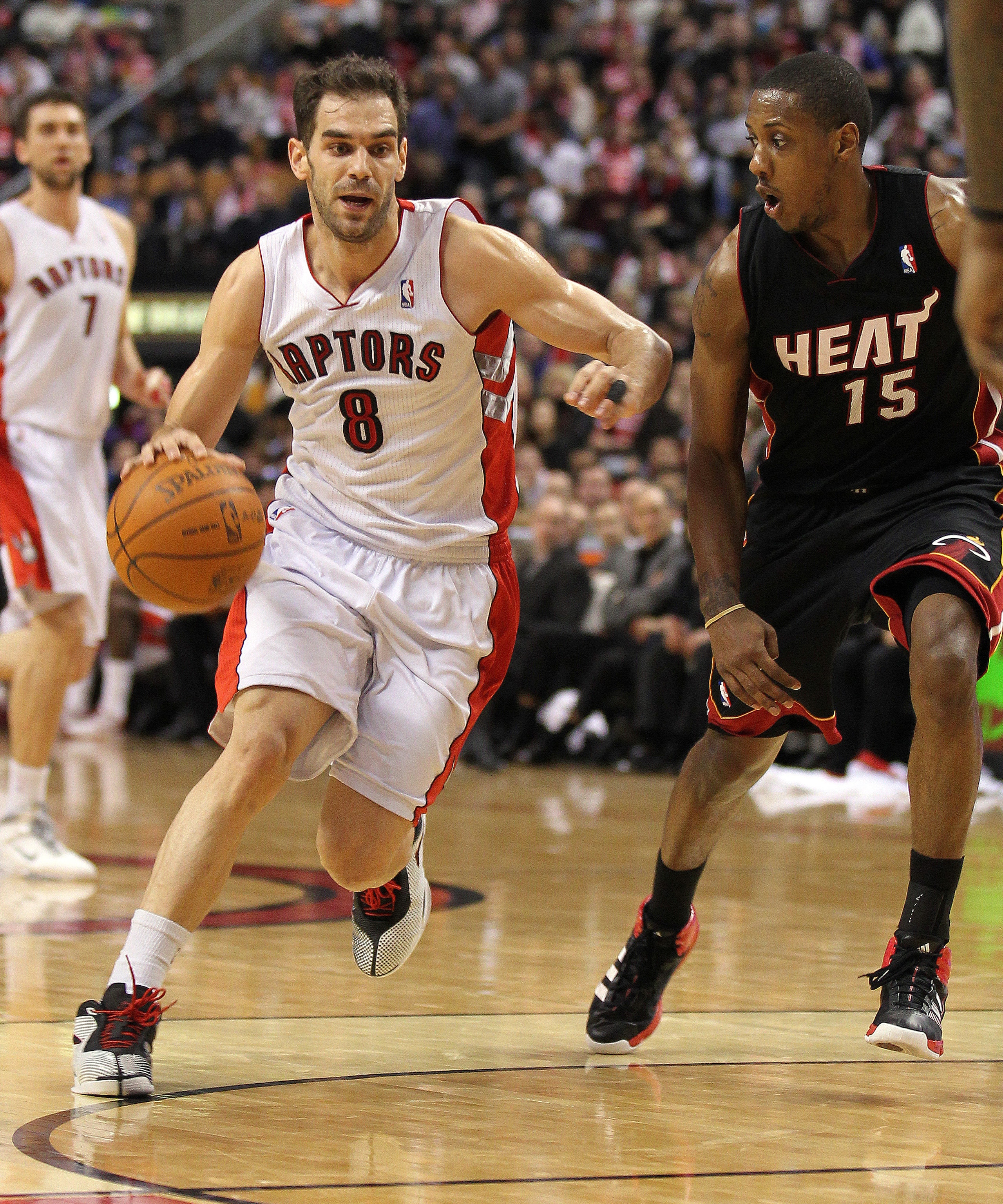 TORONTO, CANADA - FEBRUARY 16:  Jose Calderon #8 of the Toronto Raptors tries to drive around Mario Chalmers #15 of the Miami Heat in a game on February 16, 2011 at the Air Canada Centre in Toronto, Canada. The Heat defeated the Raptors 103-95. (Photo by