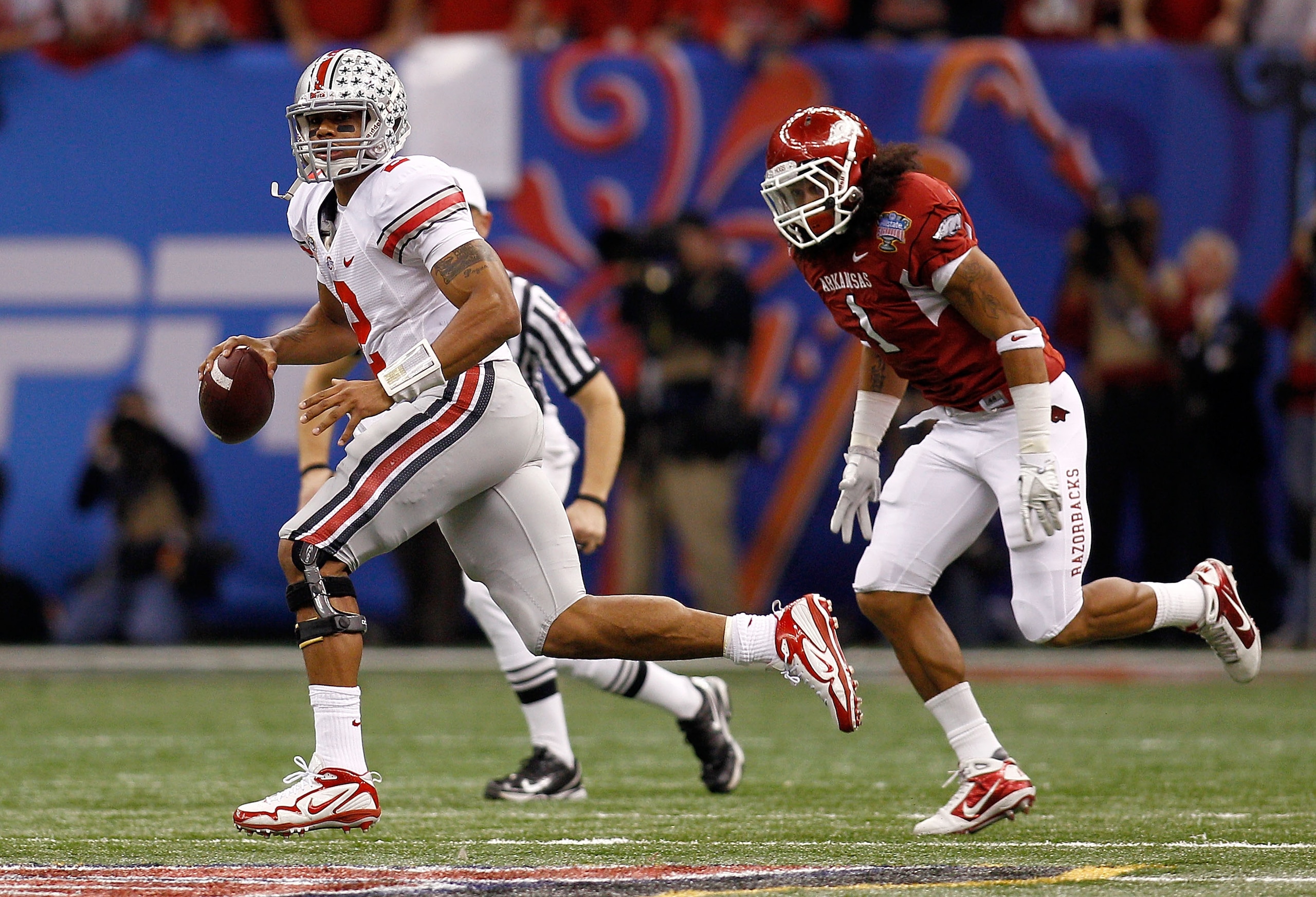 NEW ORLEANS, LA - JANUARY 04:  Quarterback Terrelle Pryor #2 of the Ohio State Buckeyes looks to run against the Arkansas Razorbacks during the Allstate Sugar Bowl at the Louisiana Superdome on January 4, 2011 in New Orleans, Louisiana.  (Photo by Chris G