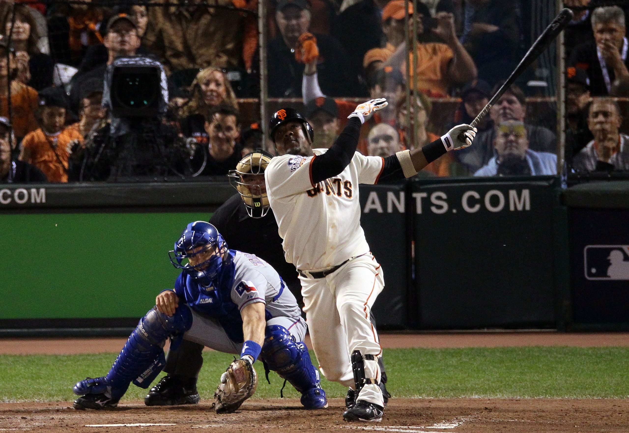 SAN FRANCISCO - OCTOBER 28:  Juan Uribe #5 of the San Francisco Giants hits a RBI double in the seventh inning off Darren Oliver #28 of the Texas Rangers in Game Two of the 2010 MLB World Series at AT&T Park on October 28, 2010 in San Francisco, Californi