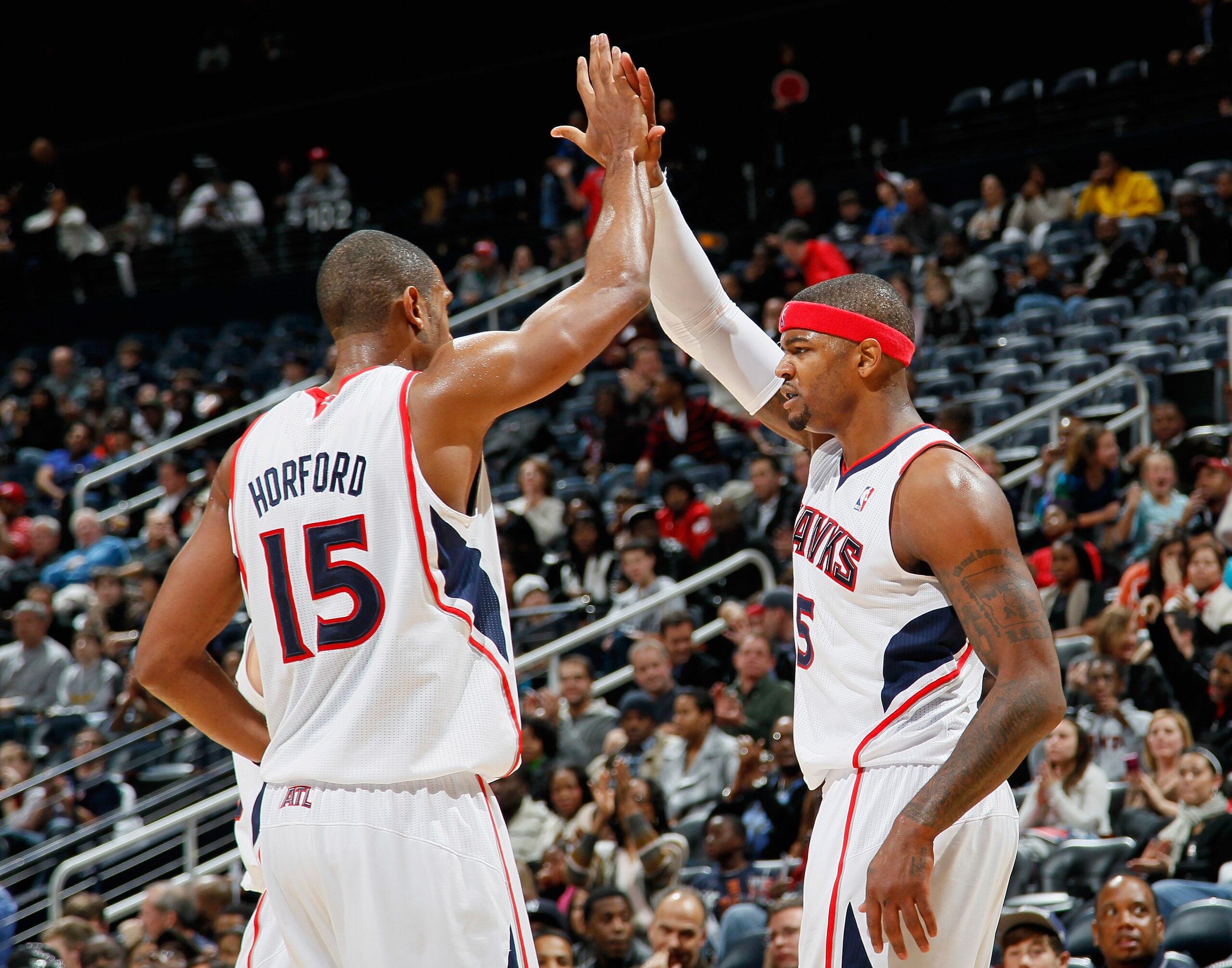 ATLANTA, GA - DECEMBER 11: Josh Smith #5 and Al Horford #15 of the Atlanta Hawks react after Smith's basket and foul against the Indiana Pacers at Philips Arena on December 11, 2010 in Atlanta, Georgia. NOTE TO USER: User expressly acknowledges and agre ATLANTA, GA - DECEMBER 11: Josh Smith #5 and Al Horford #15 of the Atlanta Hawks react after Smith's basket and foul against the Indiana Pacers at Philips Arena on December 11, 2010 in Atlanta, Georgia. NOTE TO USER: User expressly acknowledges and agre