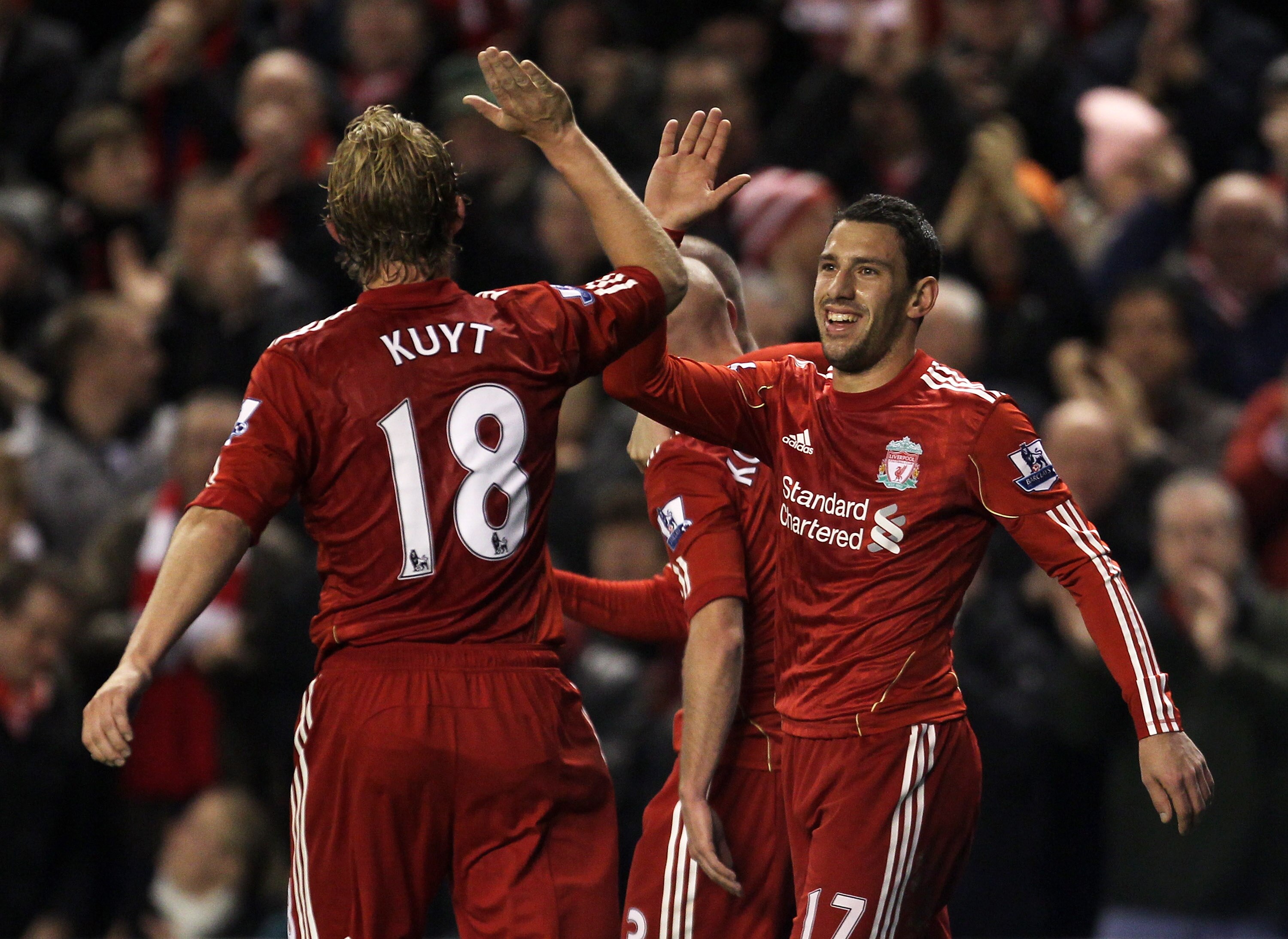 LIVERPOOL, ENGLAND - NOVEMBER 20:  Maxi Rodriguez of Liverpool celebrates scoring his team's third goal with team mate Dirk Kuyt during the Barclays Premier League match between Liverpool and West Ham United at Anfield on November 20, 2010 in Liverpool, E