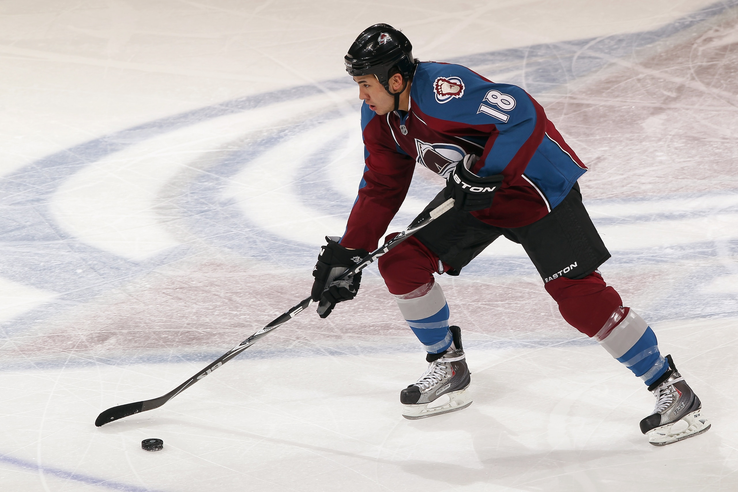 DENVER, CO - FEBRUARY 14:  Brandon Yip #18 of the Colorado Avalanche controls the puck against the Calgary Flames at the Pepsi Center on February 14, 2011 in Denver, Colorado. The Flames defeated the Avalanche 9-1.  (Photo by Doug Pensinger/Getty Images)