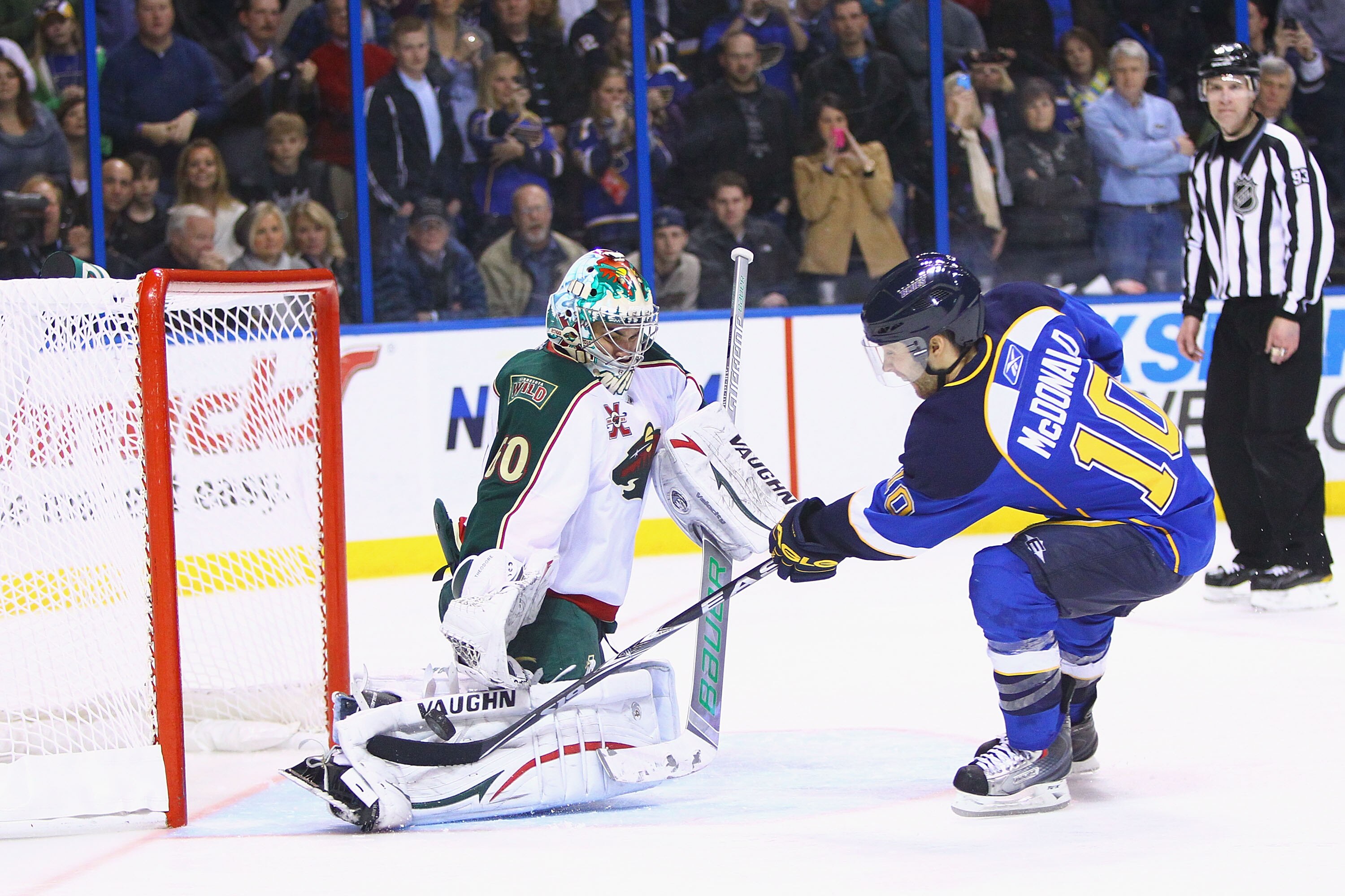 ST. LOUIS, MO - FEBRUARY 11: Jose Theodore #60 of the Minnesota Wild makes a save against Andy McDonald #10 of the St. Louis Blues during a shootout at the Scottrade Center on February 11, 2011 in St. Louis, Missouri.  The Wild won 5-4 in a shootout.  (Ph