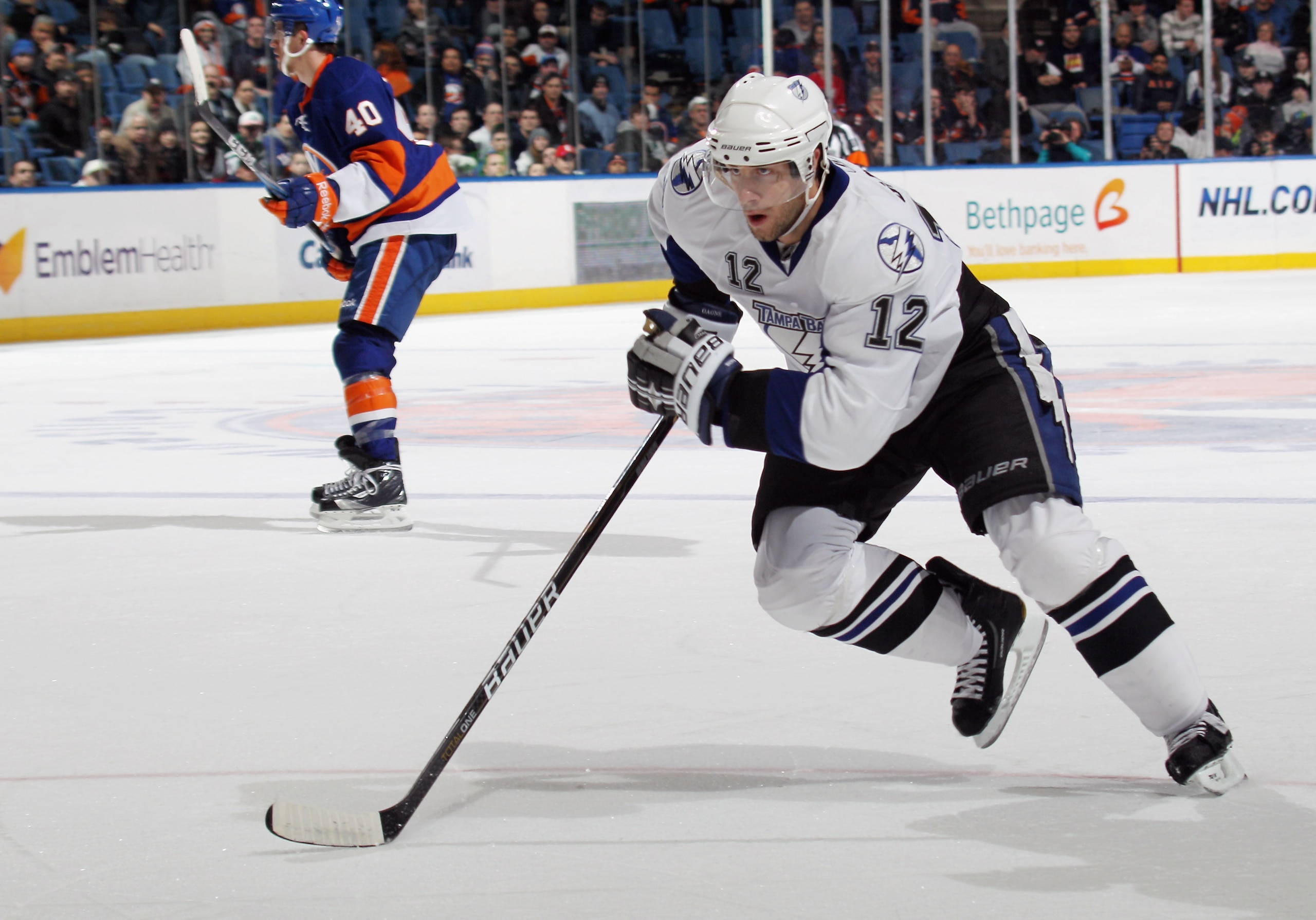 UNIONDALE, NY - DECEMBER 22:  Simon Gagne #12 of the Tampa Bay Lightning skates against the New York Islanders at the Nassau Coliseum on December 22, 2010 in Uniondale, New York.  (Photo by Bruce Bennett/Getty Images)