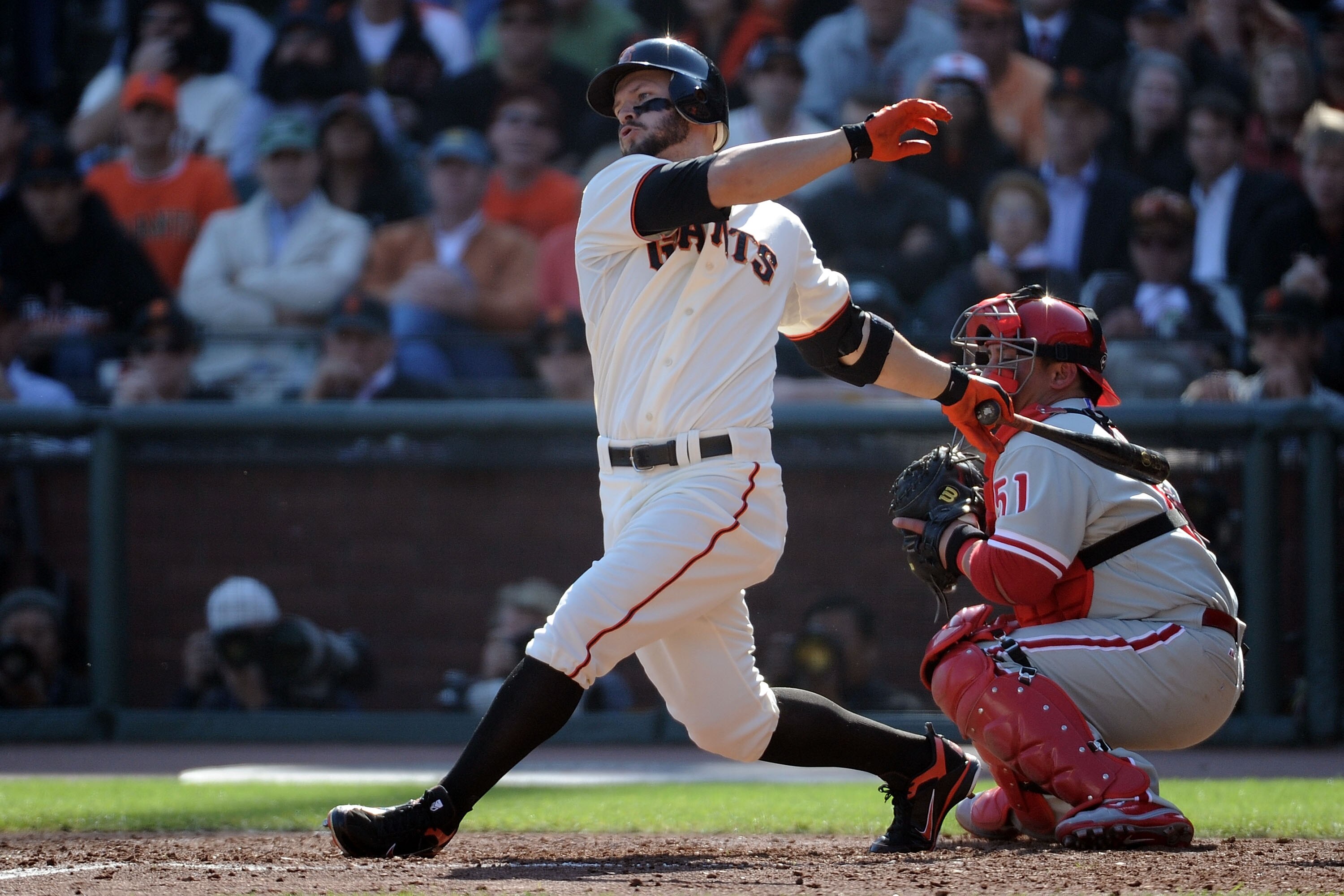 SAN FRANCISCO - OCTOBER 19:  Cody Ross #13 of the San Francisco Giants hit a RBI single against Cole Hamels #35 of the Philadelphia Phillies in the fourth inning of Game Three of the NLCS during the 2010 MLB Playoffs at AT&T Park on October 19, 2010 in Sa