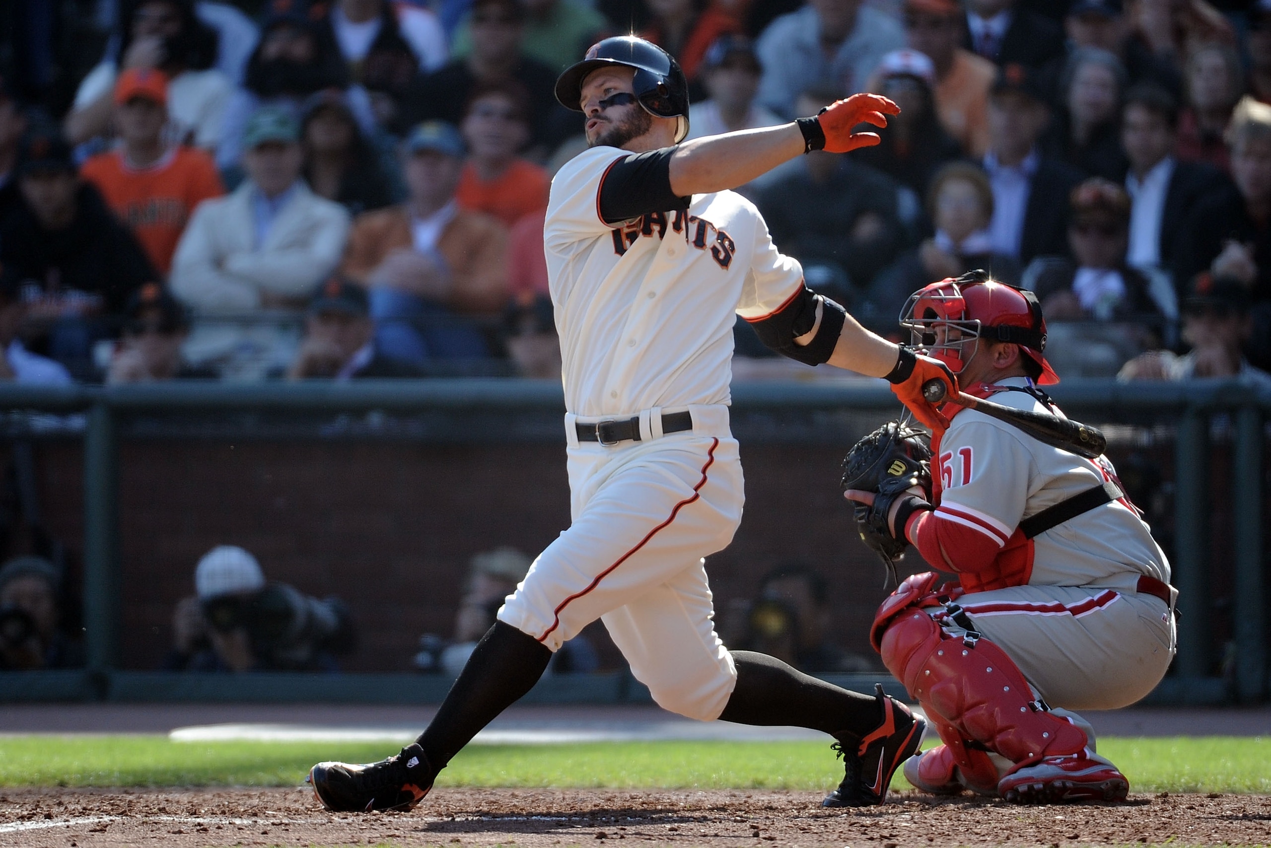 SAN FRANCISCO - OCTOBER 19:  Cody Ross #13 of the San Francisco Giants hit a RBI single against Cole Hamels #35 of the Philadelphia Phillies in the fourth inning of Game Three of the NLCS during the 2010 MLB Playoffs at AT&T Park on October 19, 2010 in Sa