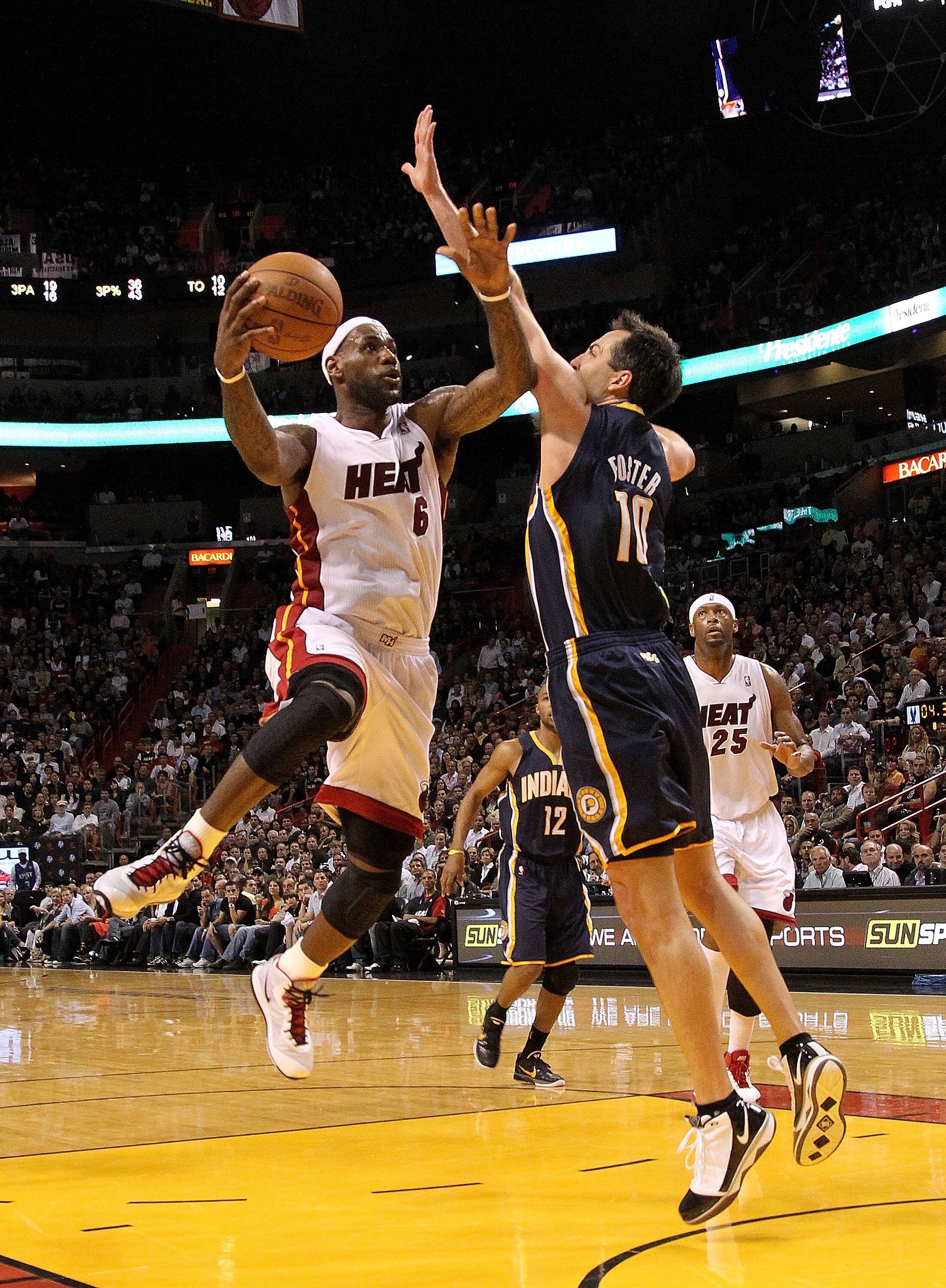 MIAMI, FL - FEBRUARY 08:  LeBron James #6 of the Miami Heat shoots over Jeff Foster #10 of the Indiana Pacers during a game at American Airlines Arena on February 8, 2011 in Miami, Florida. NOTE TO USER: User expressly acknowledges and agrees that, by dow