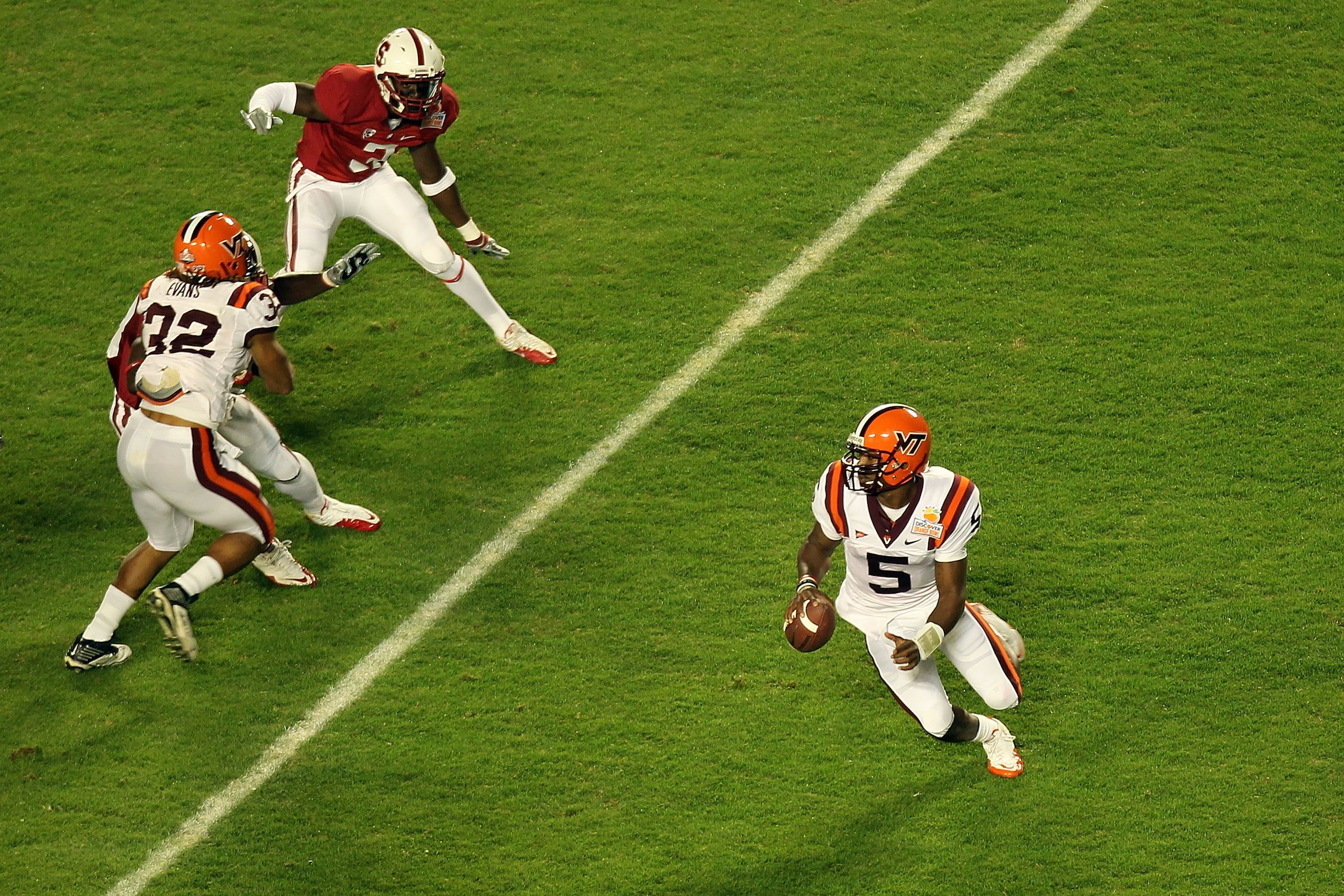 MIAMI, FL - JANUARY 03:  Tyrod Taylor #5 of the Virginia Tech Hokies rolls out of the pocket against the Stanford Cardinal during the 2011 Discover Orange Bowl at Sun Life Stadium on January 3, 2011 in Miami, Florida. Stanford won 40-12. (Photo by Mike Eh