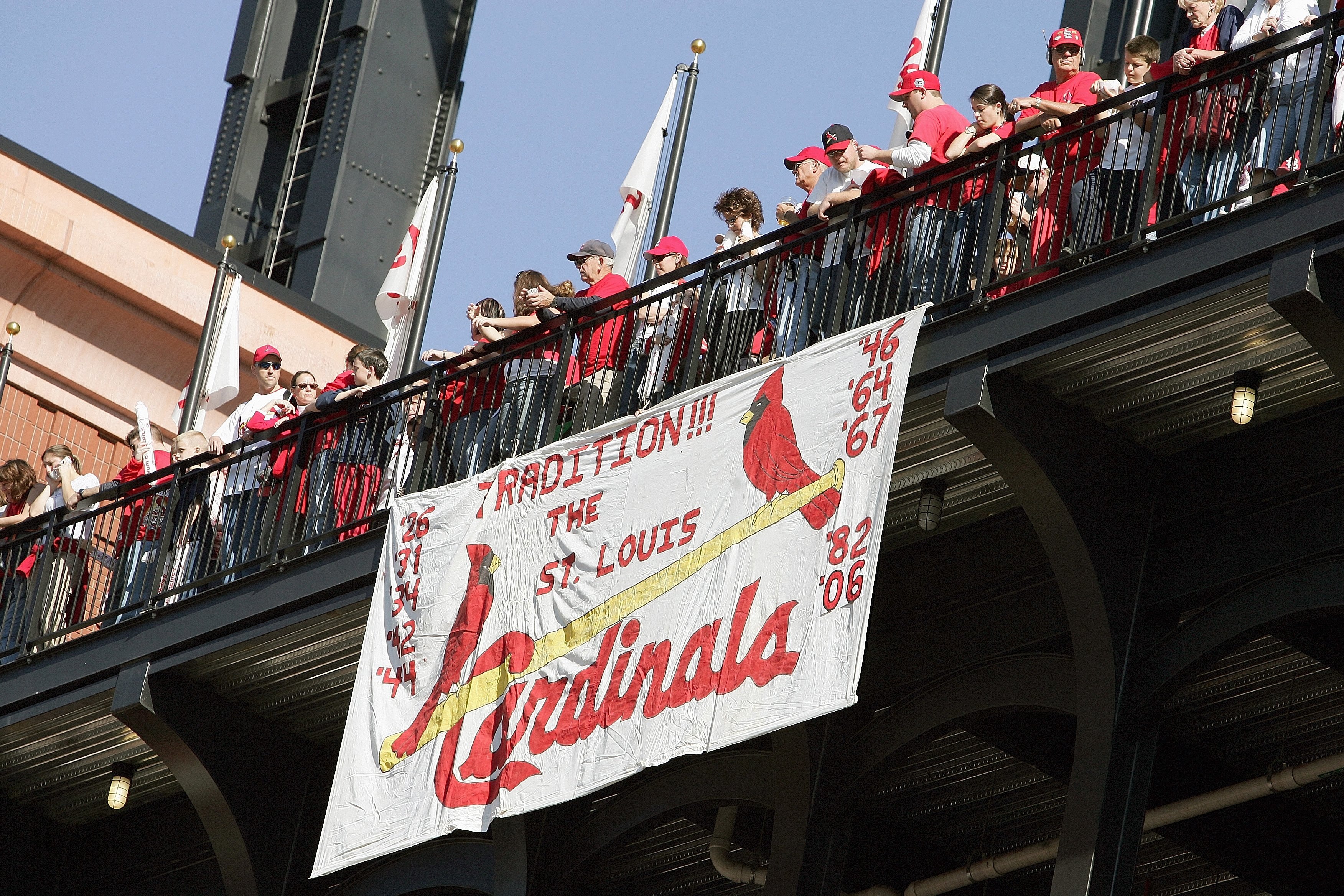 ST. LOUIS - OCTOBER 29:  Fans of the St. Louis Cardinals line the walkway above a hand made sign during the World Series Victory Parade and Rally on October 29, 2006 at Busch Stadium in St. Louis, Missouri.  (Photo by Elsa/Getty Images)