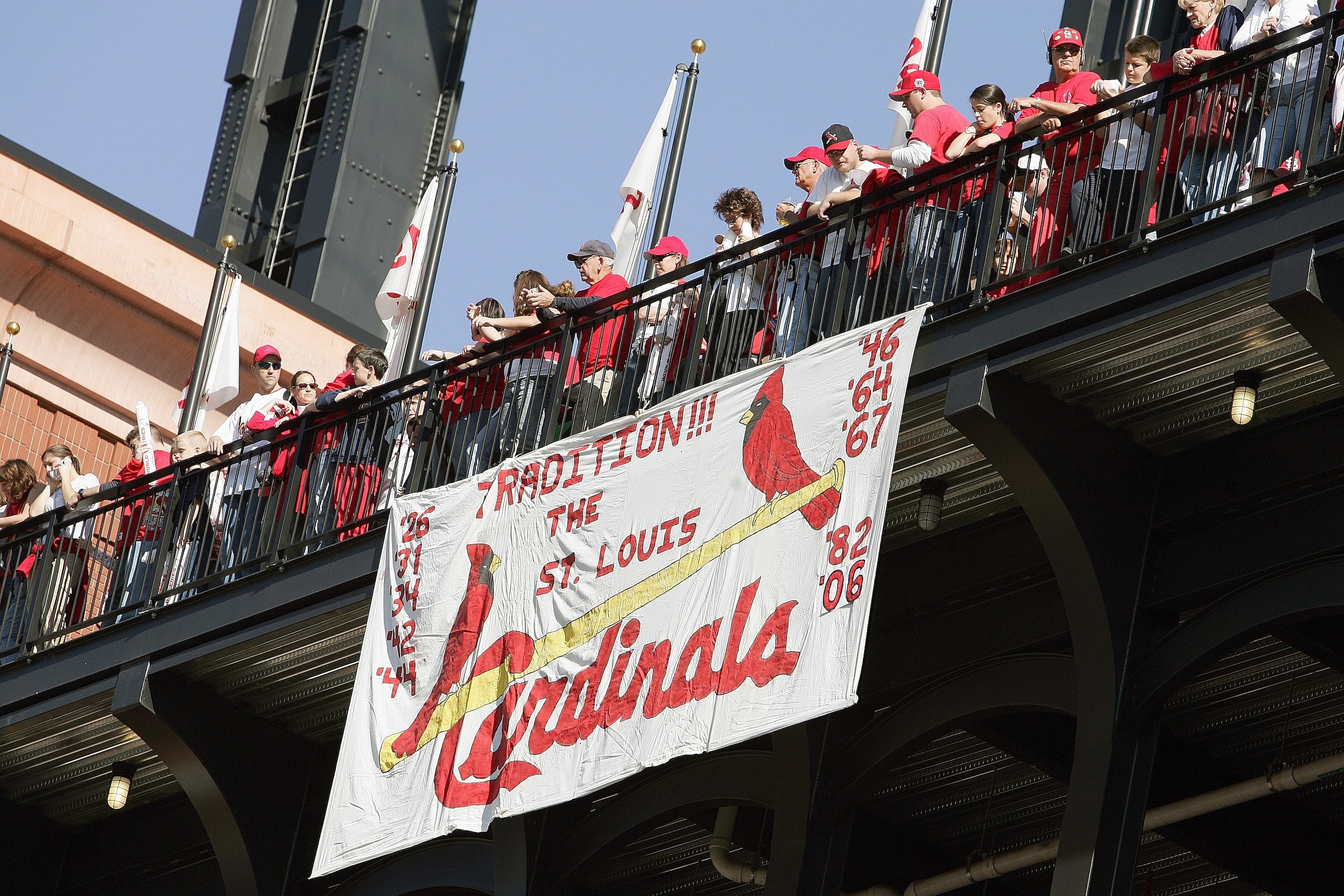 ST. LOUIS - OCTOBER 29: Fans of the St. Louis Cardinals line the walkway above a hand made sign during the World Series Victory Parade and Rally on October 29, 2006 at Busch Stadium in St. Louis, Missouri. (Photo by Elsa/Getty Images) ST. LOUIS - OCTOBER 29: Fans of the St. Louis Cardinals line the walkway above a hand made sign during the World Series Victory Parade and Rally on October 29, 2006 at Busch Stadium in St. Louis, Missouri. (Photo by Elsa/Getty Images)