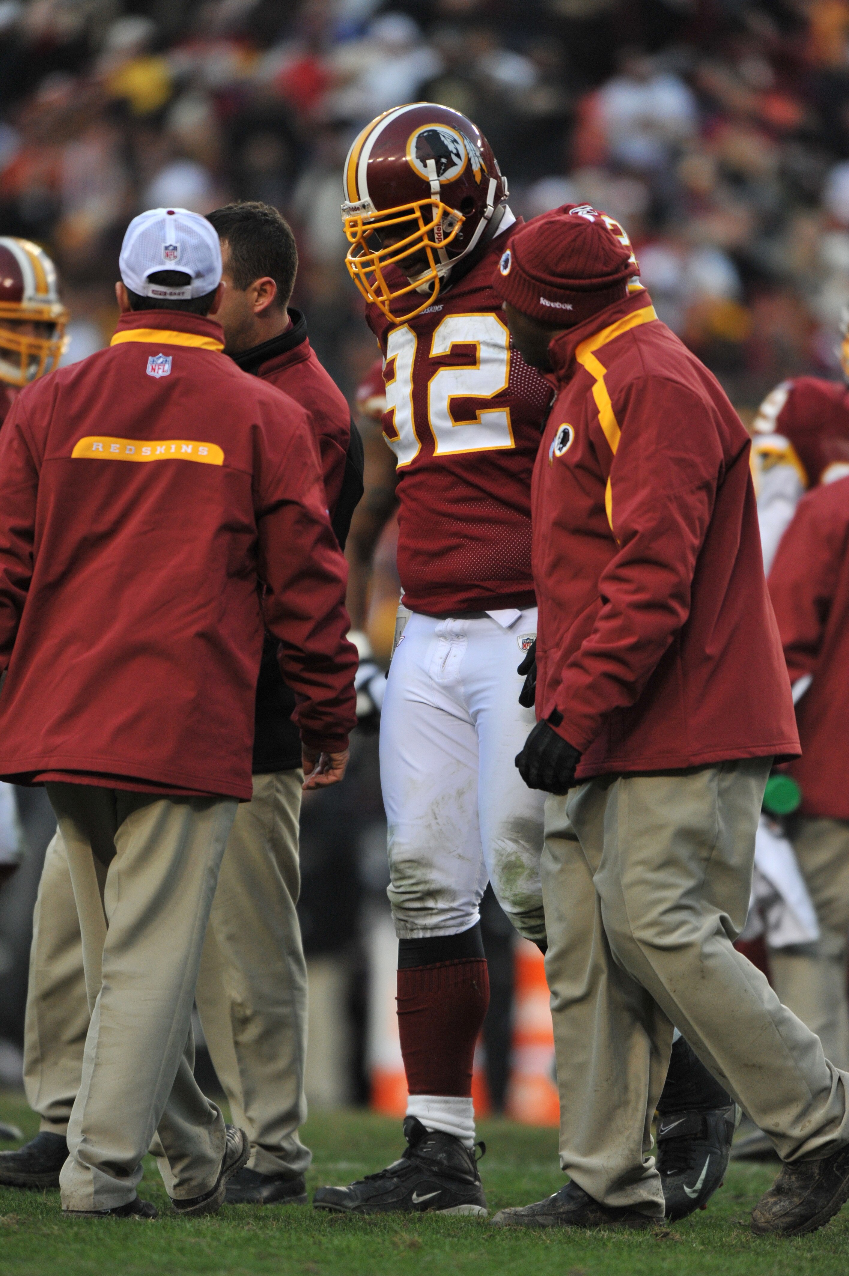 LANDOVER, MD - DECEMBER 6:  Albert Haynesworth #92 of the Washington Redskins is helped off the field after being injured during the game against the New Orleans Saints at FedExField on December 6, 2009 in Landover, Maryland. The Saints defeated the Redsk