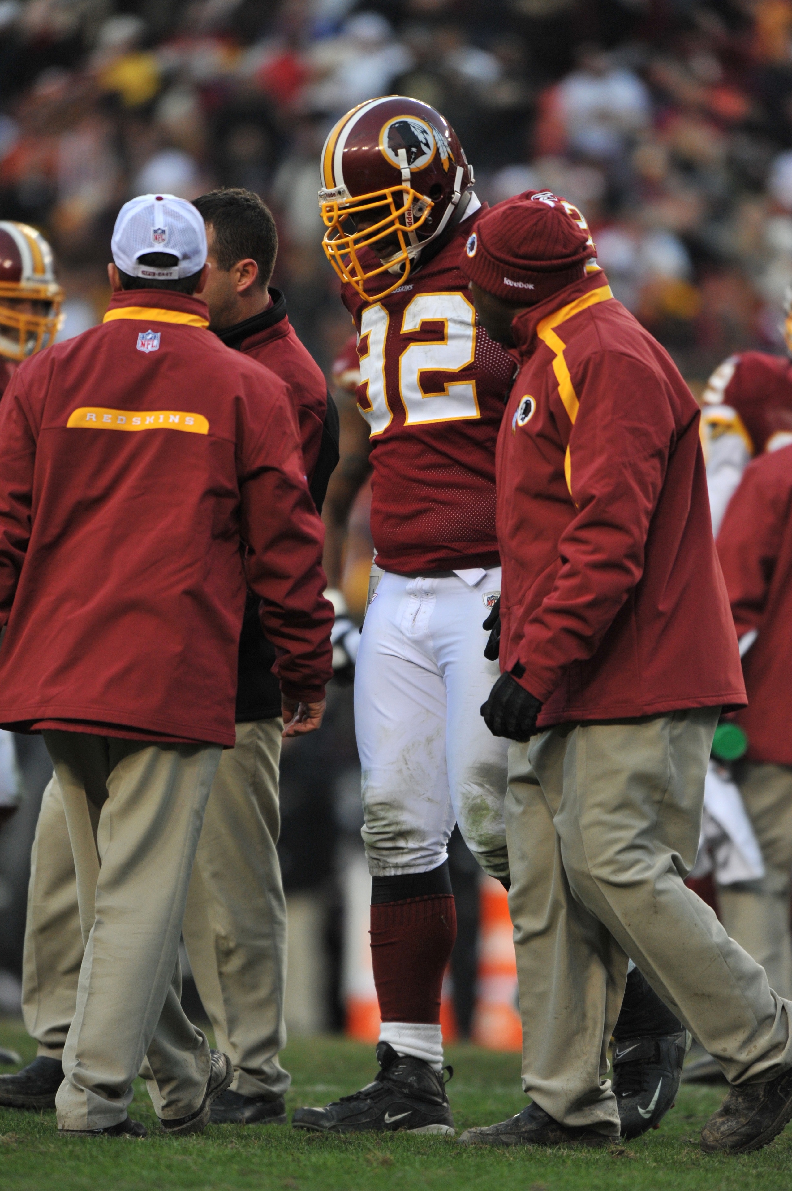 LANDOVER, MD - DECEMBER 6:  Albert Haynesworth #92 of the Washington Redskins is helped off the field after being injured during the game against the New Orleans Saints at FedExField on December 6, 2009 in Landover, Maryland. The Saints defeated the Redsk