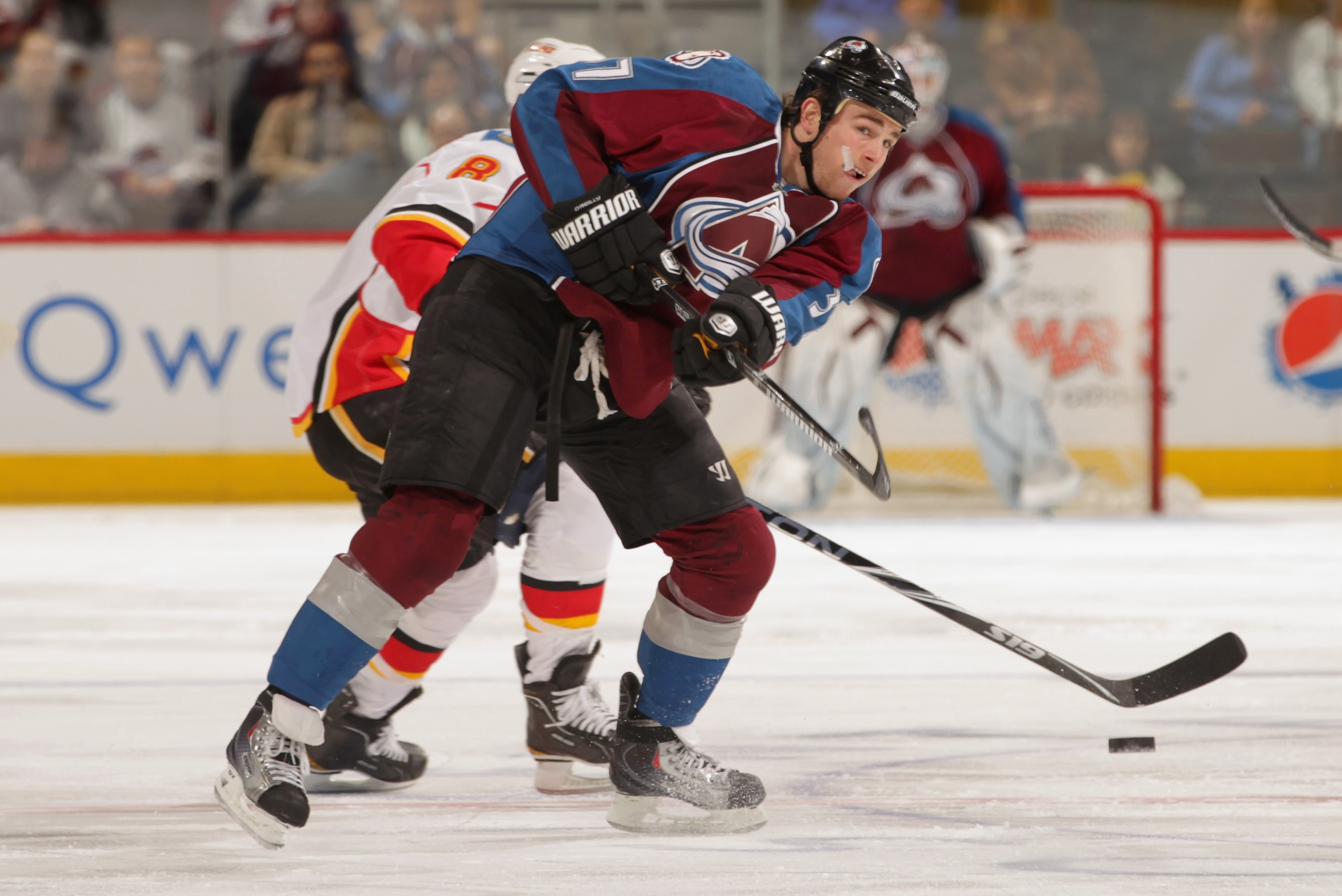 DENVER, CO - FEBRUARY 14:  Ryan O'Reilly #37 of the Colorado Avalanche controls the puck against the Calgary Flames at the Pepsi Center on February 14, 2011 in Denver, Colorado. The Flames defeated the Avalanche 9-1.  (Photo by Doug Pensinger/Getty Images