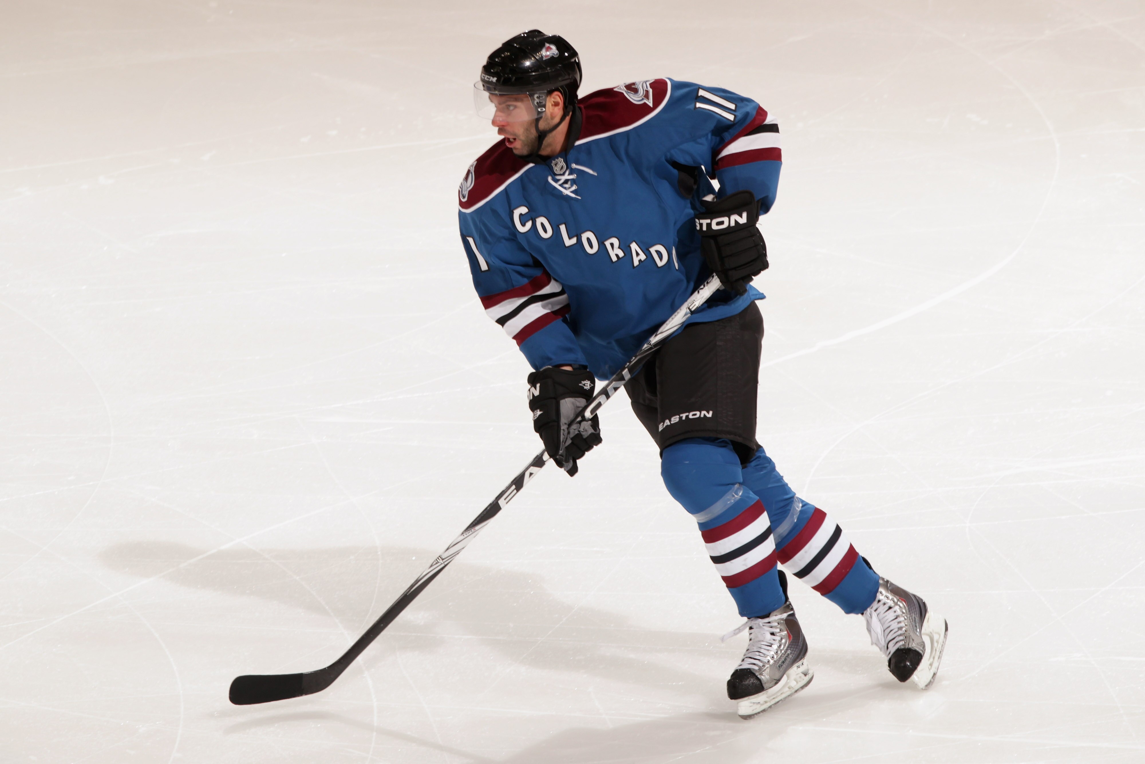 DENVER, CO - FEBRUARY 16:  Philippe Dupuis #11 of the Colorado Avalanche skates against the Pittsburgh Penguins at the Pepsi Center on February 16, 2011 in Denver, Colorado. The Penguins defeated the Avalanche 3-2 in overtime.  (Photo by Doug Pensinger/Ge