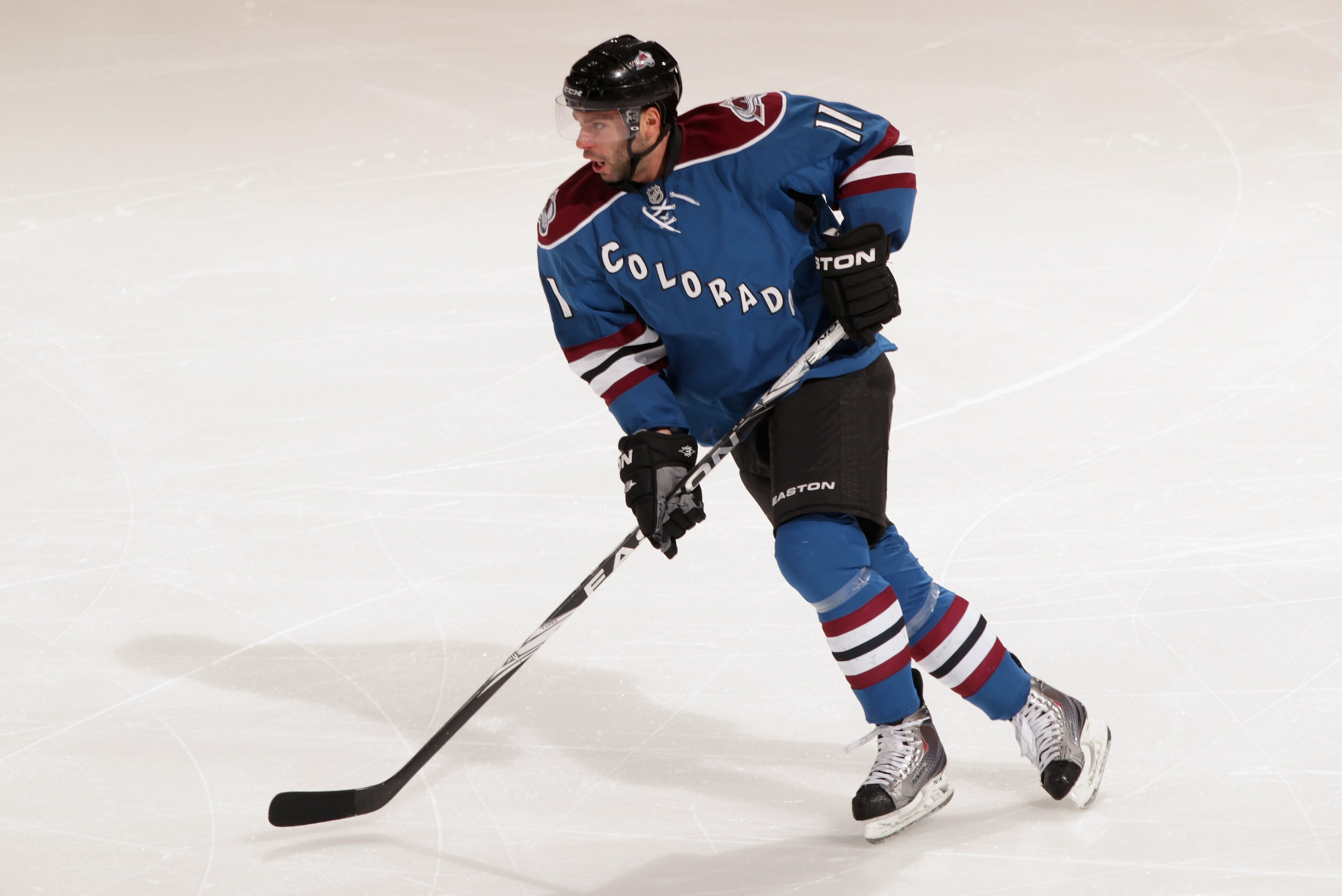 DENVER, CO - FEBRUARY 16:  Philippe Dupuis #11 of the Colorado Avalanche skates against the Pittsburgh Penguins at the Pepsi Center on February 16, 2011 in Denver, Colorado. The Penguins defeated the Avalanche 3-2 in overtime.  (Photo by Doug Pensinger/Ge