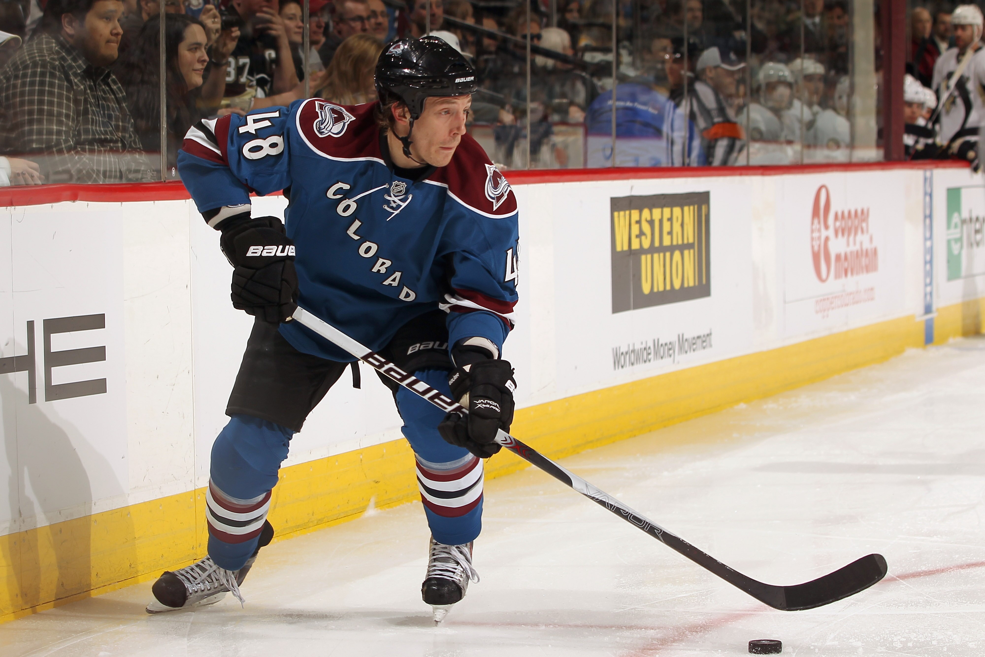 DENVER, CO - FEBRUARY 16:  Matt Hunwick #48 of the Colorado Avalanche controls the puck against the Pittsburgh Penguins at the Pepsi Center on February 16, 2011 in Denver, Colorado. The Penguins defeated the Avalanche 3-2 in overtime.  (Photo by Doug Pens