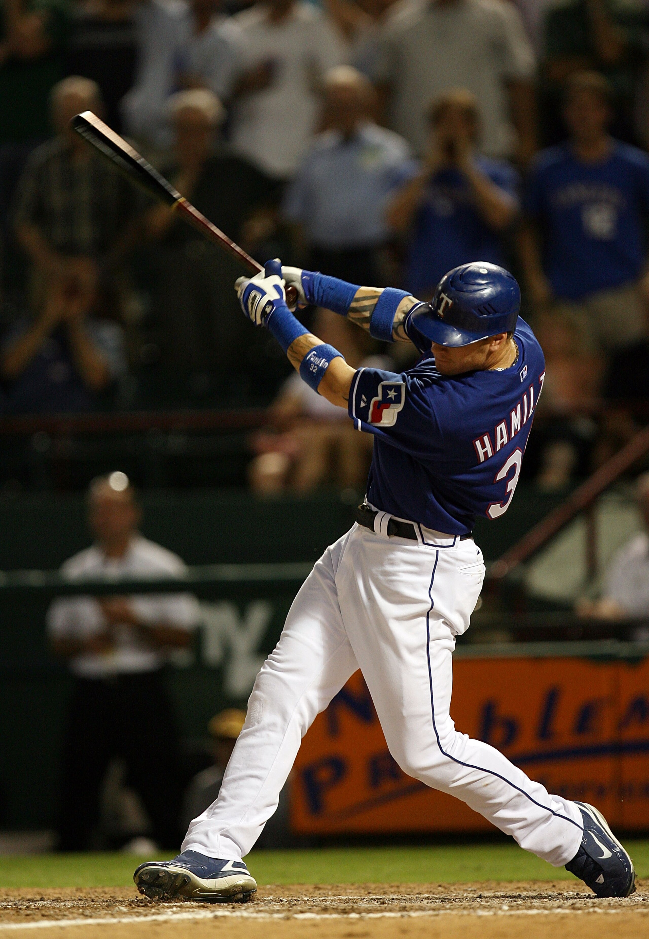 ARLINGTON, TX - JULY 09:  Josh Hamilton #32 of the Texas Rangers hits the game-winning home run against the Los Angeles Angels of Anaheim in the ninth inning on July 9, 2008 at Rangers Ballpark in Arlington, Texas.  (Photo by Ronald Martinez/Getty Images)