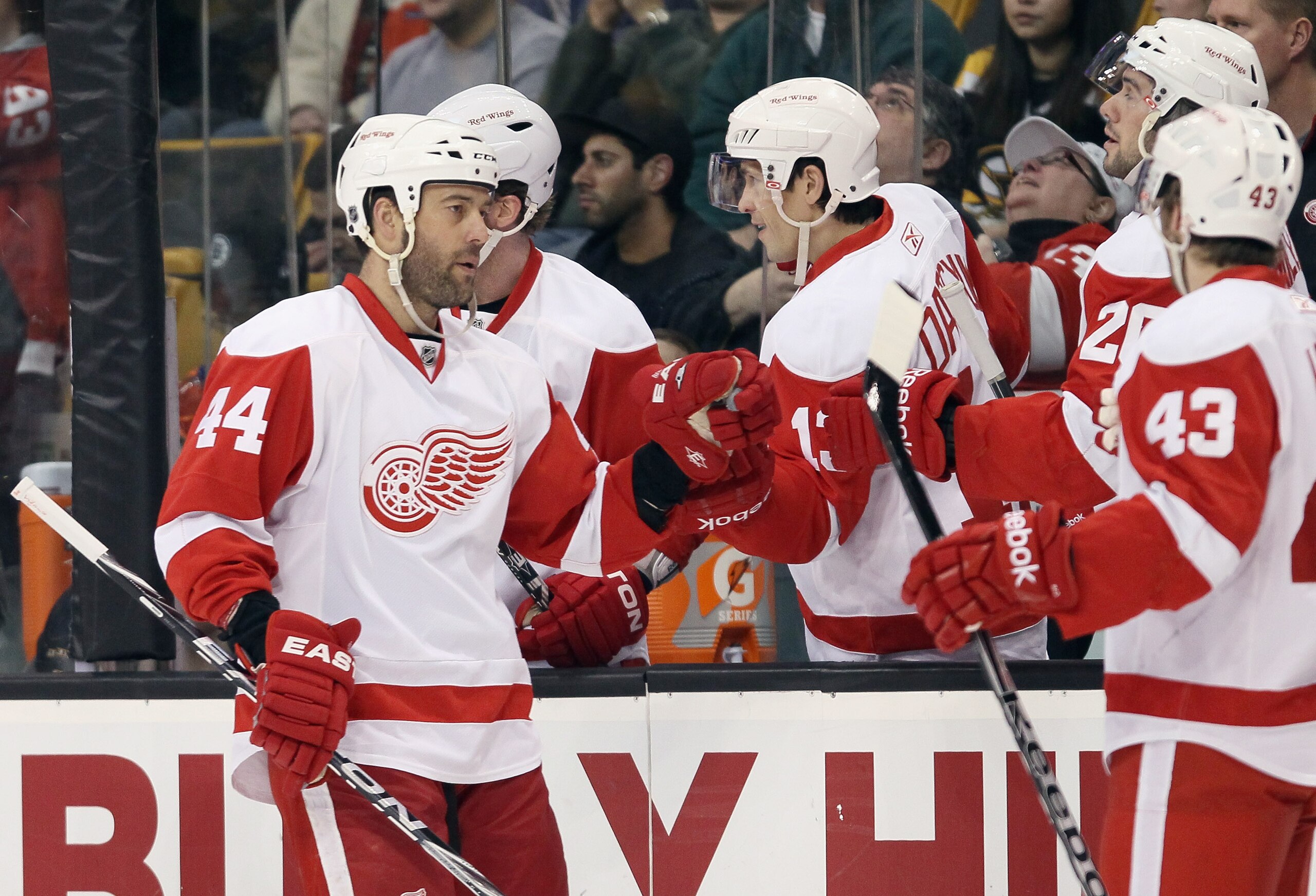 BOSTON, MA - FEBRUARY 11:  Todd Bertuzzi #44 of the Detroit Red Wings is congratulated by teammates Pavel Datsyuk #13 and Drew Miller #20 after Bertuzzi scored in the first period against the Boston Bruins on February 11, 2011 at the TD Garden in Boston,