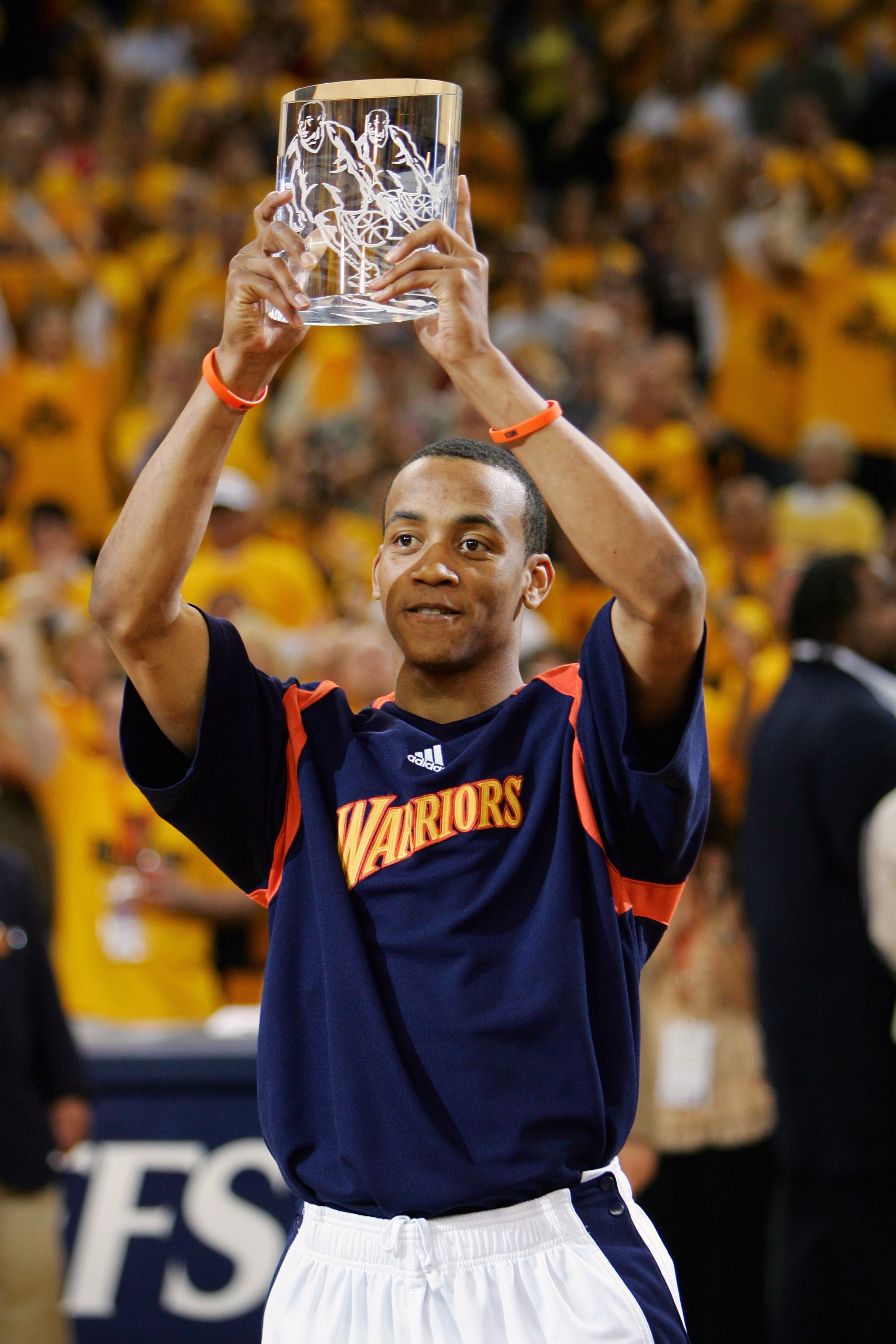 OAKLAND, CA - APRIL 27:  Monta Ellis #8 of the Golden State Warriors holds up his 'Most Improved Player' award before Game Three of the Western Conference Quarterfinals against the Dallas Mavericks during the 2007 NBA Playoffs at Oracle Arena on April 27,